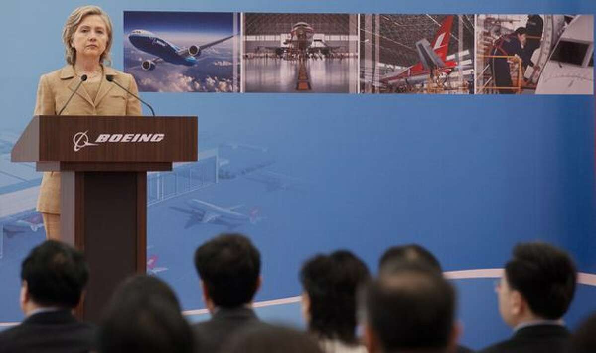 U.S. Secretary of State Hillary Clinton speaks on commercial development at the Boeing Maintenance Facility at Pudong International Airport in Shanghai.