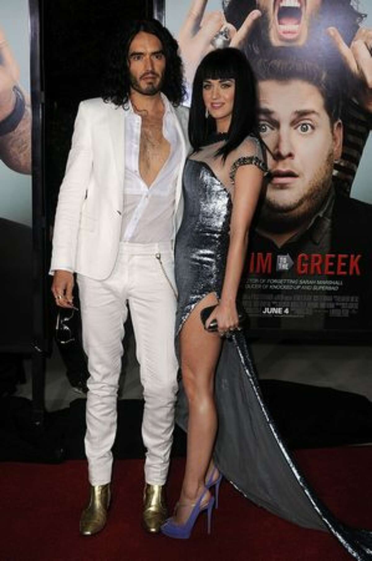 Actor/comedian Russell Brand (L) and singer Katy Perry arrive at the premiere of Universal Pictures' "Get Him To The Greek" held at the Greek Theatre in Los Angeles, California.