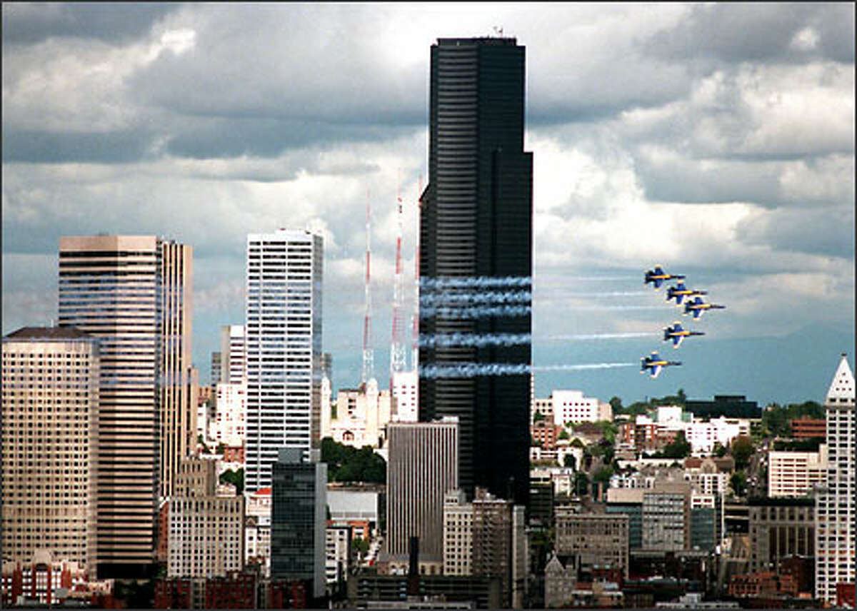 The Blue Angels streak across the Seattle skyline.