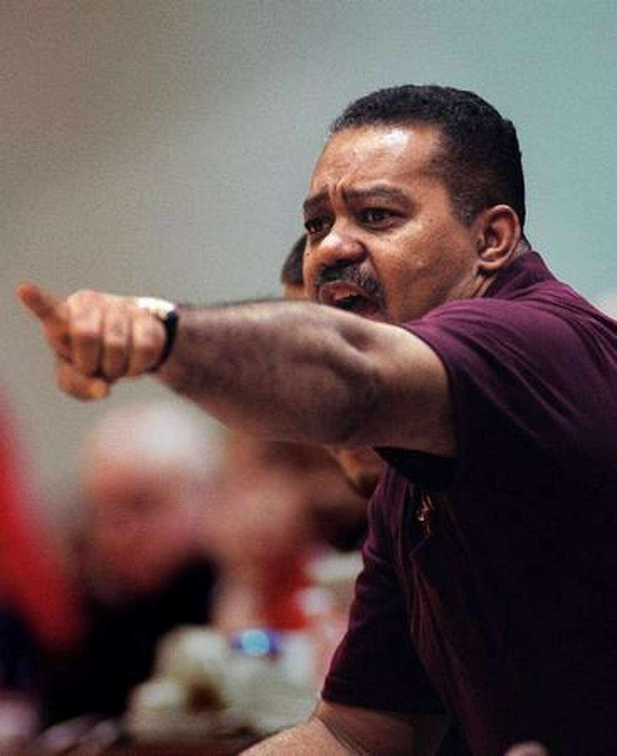 O'Dea basketball coach Phil Lumpkin yells to a player during the 1997 basketball championship tournament at Seattle Pacific University. O'Dea kept its perfect record intact and won the Sea-King District title that night, beating Cleveland 84-54. (Ellen M. Banner/seattlepi.com file)