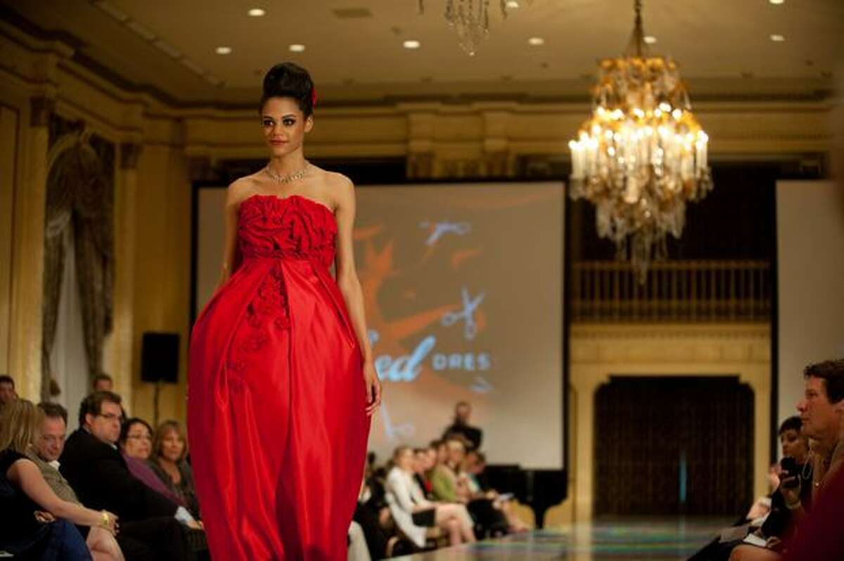 A model wears a dress designed by Molly Griffith of New York Fashion Academy during the third annual Project Red Dress event in Fairmont Olympic Hotel.