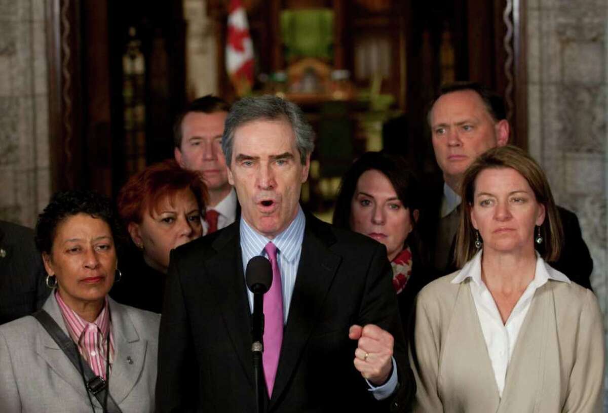 Liberal leader Michael Ignatieff speaks with the media in the foyer of the House of Commons on Parliament Hill in Ottawa on Friday, March 25, 2011 following the defeat of the government. (AP Photo/The Canadian Press, Adrian Wyld)