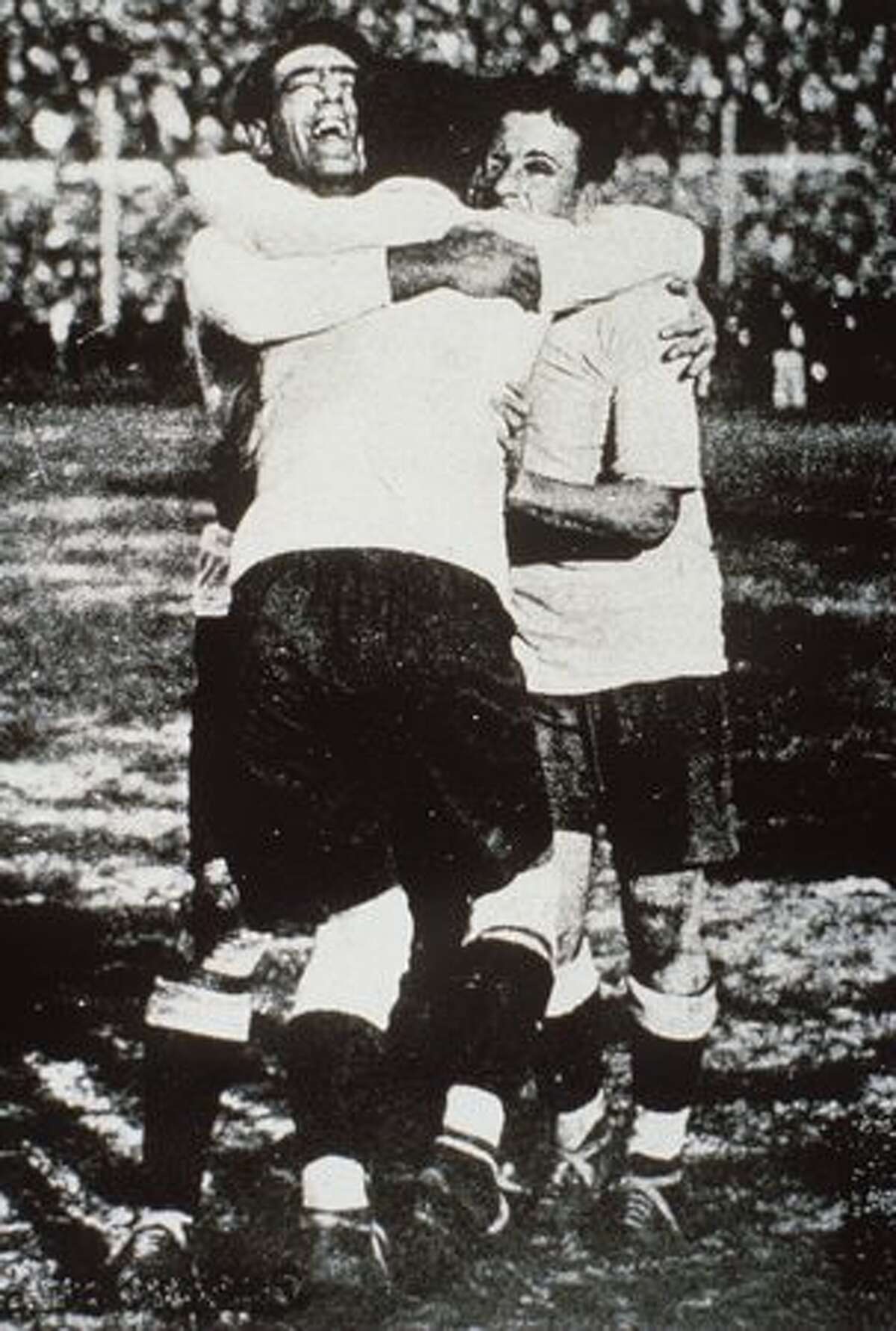 1930: Fernandez, Cea and Scarone of Uruguay celebrate during the final.