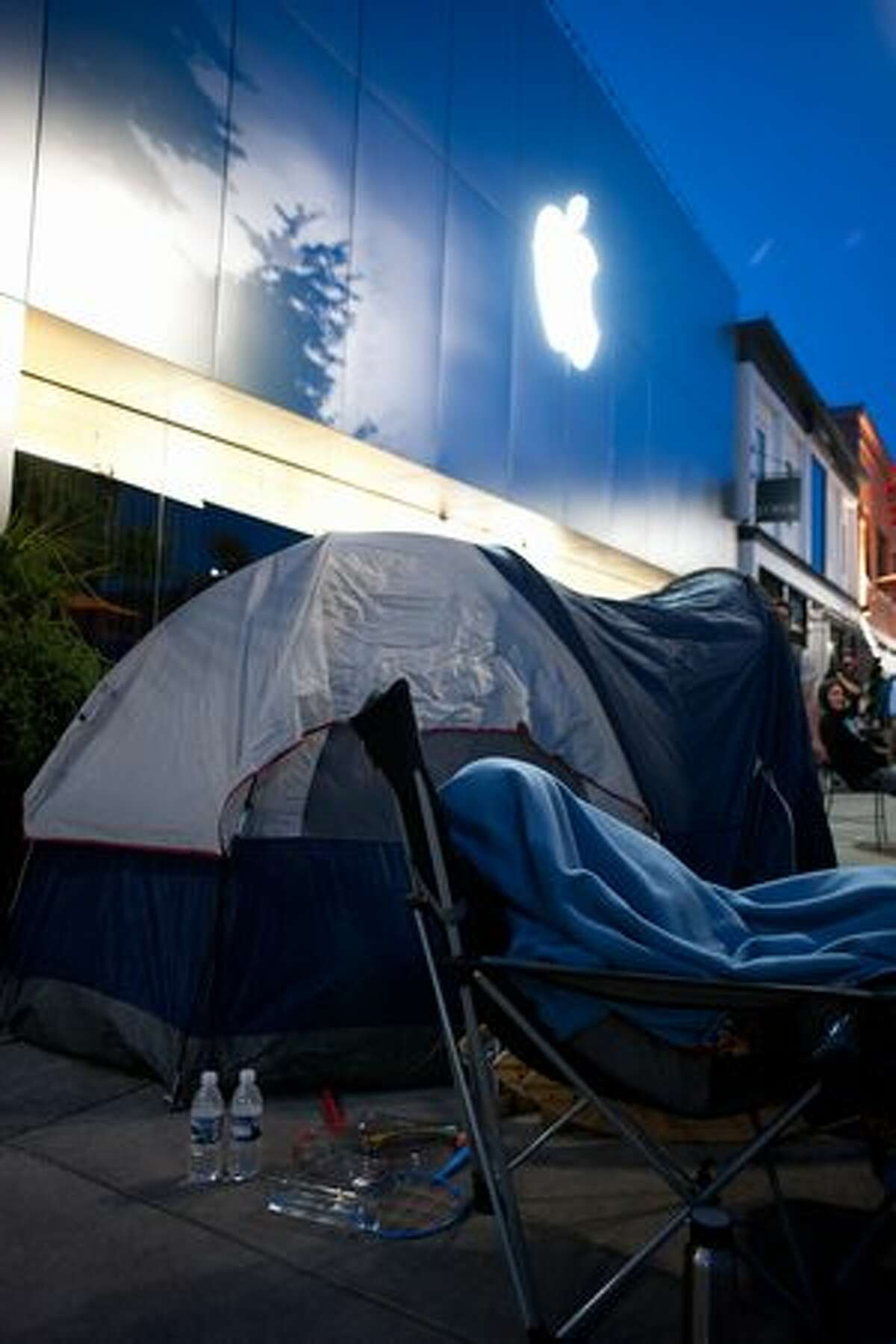 The scene outside of the Apple store in University Village looked more like a campsite than a shopping center as consumers waited for doors to open Thursday.