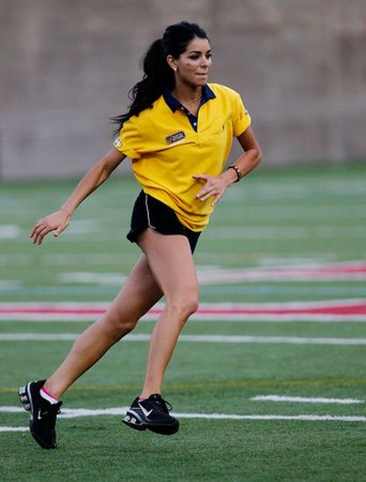 Rima Fakih plays at pro football quarterback Tom Brady's charity flag football match on June 4 in Boston.