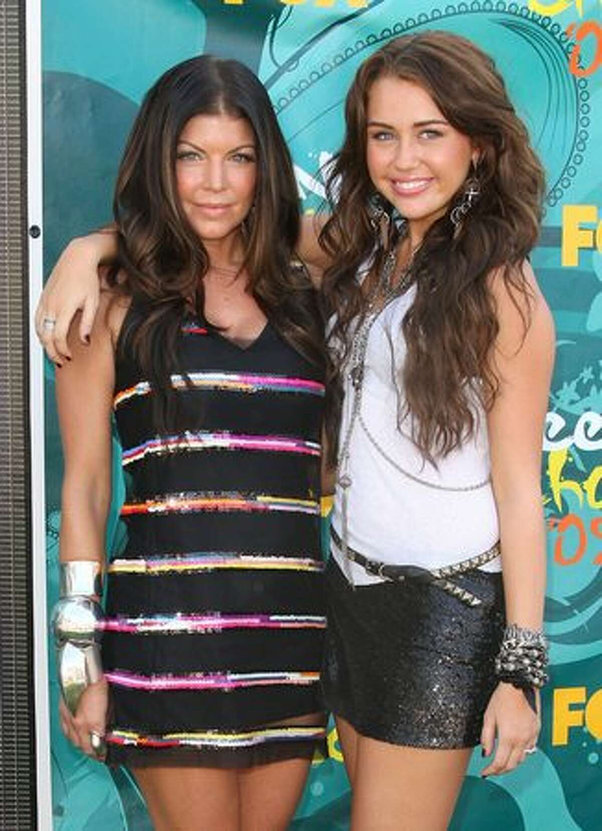 Singer/actress Fergie and Cyrus arrive at the 2009 Teen Choice Awards held at Gibson Amphitheatre in Universal City, Calif., on August 9, 2009.