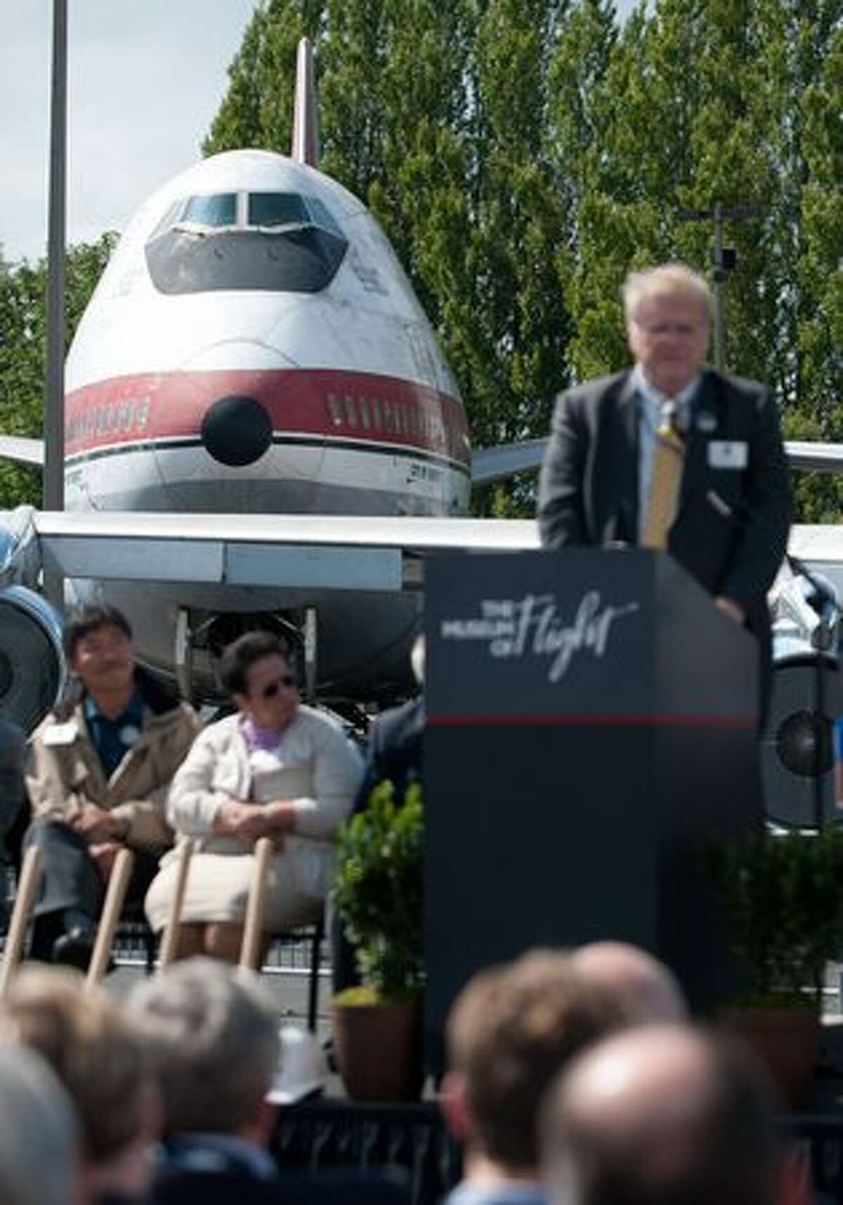 The Museum of Flight's 747-121 is seen behind museum Interim President Michael Hallman as he speaks at the groundbreaking for the museum's Human Space Flight Gallery.