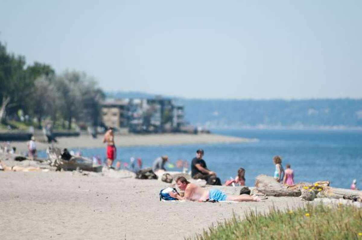 Seattleites flock to beaches and parks on a hot summer day.