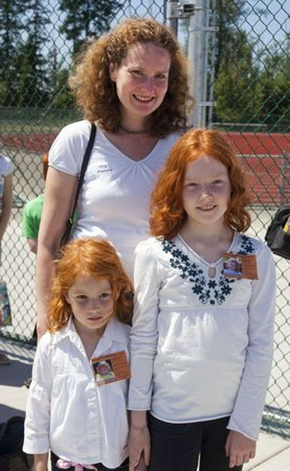 Lisann, 4, Laura, 9 and Maren Draeger were visiting from Germany and decided to participate in Redheads and More Redheads Day.
