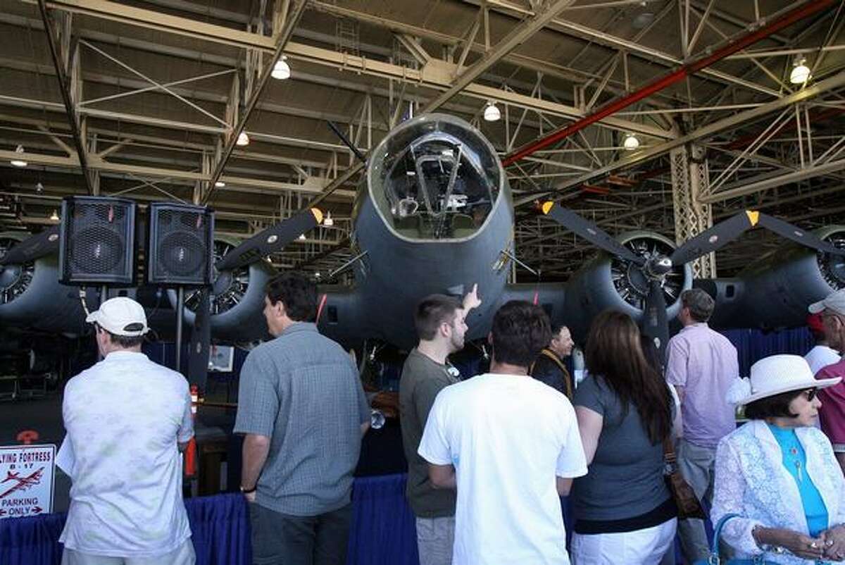 Visitors check out the Museum of Flight's restored B-17 Flying Fortress during a ceremony at Boeing's Plant 2 to mark the 75th anniversary of the B-17's first flight.