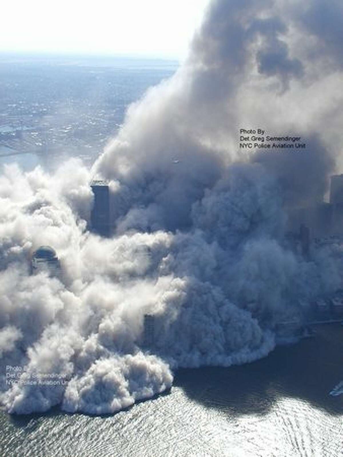 This photo taken Sept. 11, 2001 by the New York City Police Department and obtained by ABC News, which claims to have obtained it under the Freedom of Information Act in 2010, shows smoke and ash rising in the area around the World Trade Center in New York. (AP Photo/NYPD via ABC News, Det. Greg Semendinger)