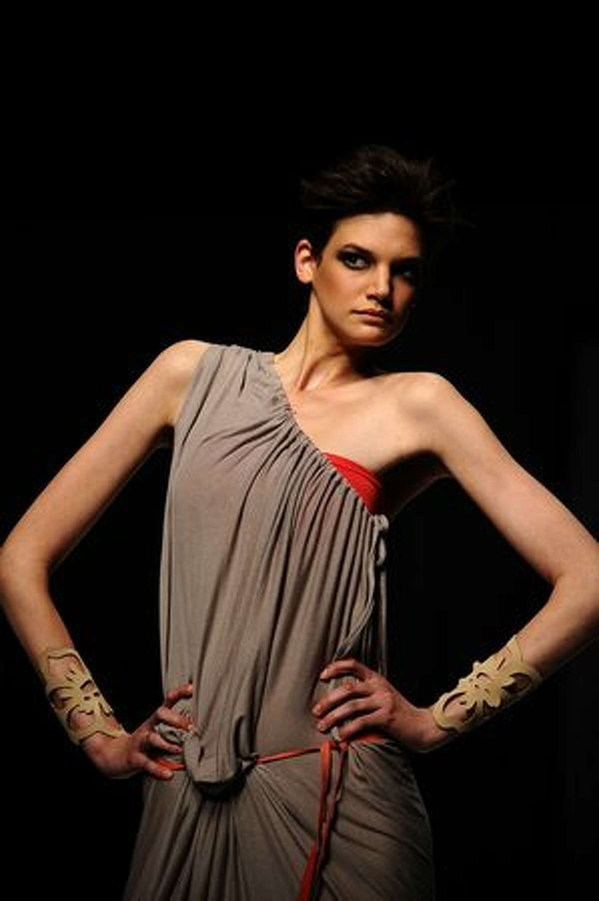 A model showcases a creation by designer "Michelle Ludek" on August 12, 2010 during the Cape Town fashion week at the Cape Town International Convention Center in Cape Town.