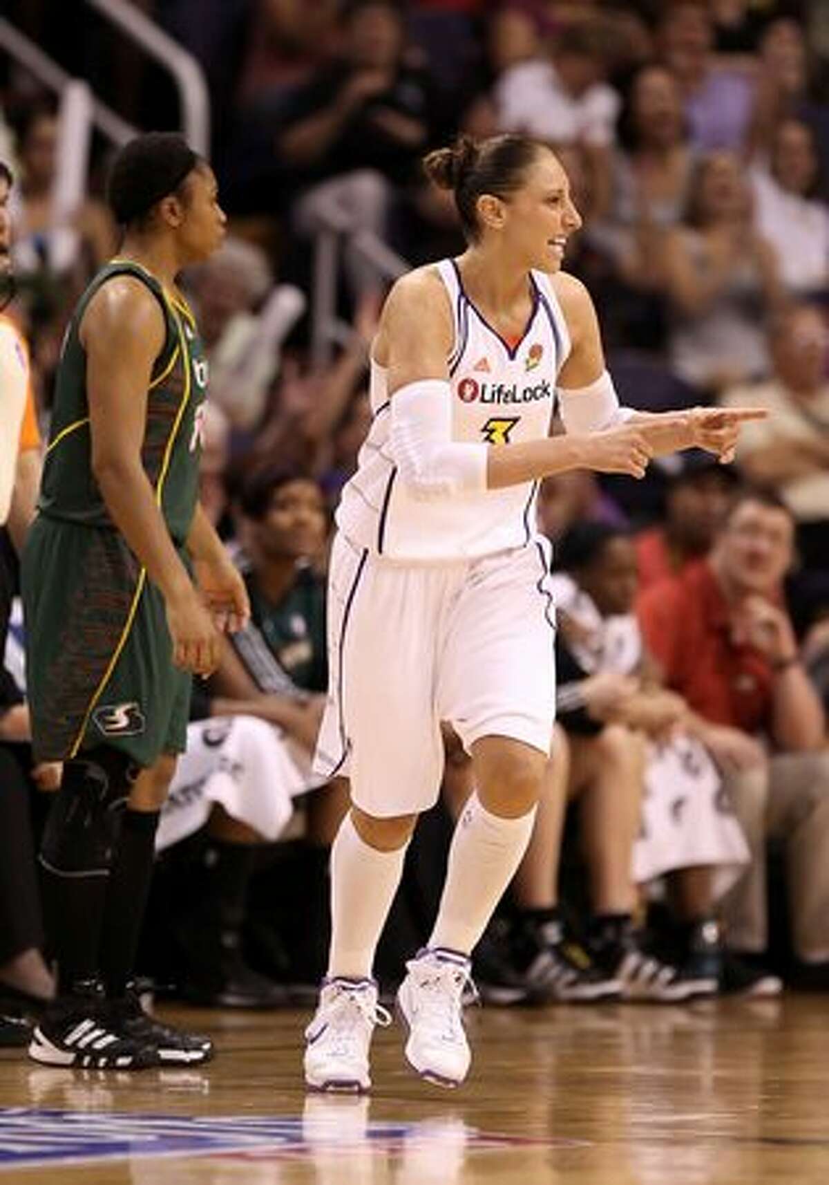 Diana Taurasi #3 of the Phoenix Mercury celebrates after hitting a three point shot against the Seattle Storm.