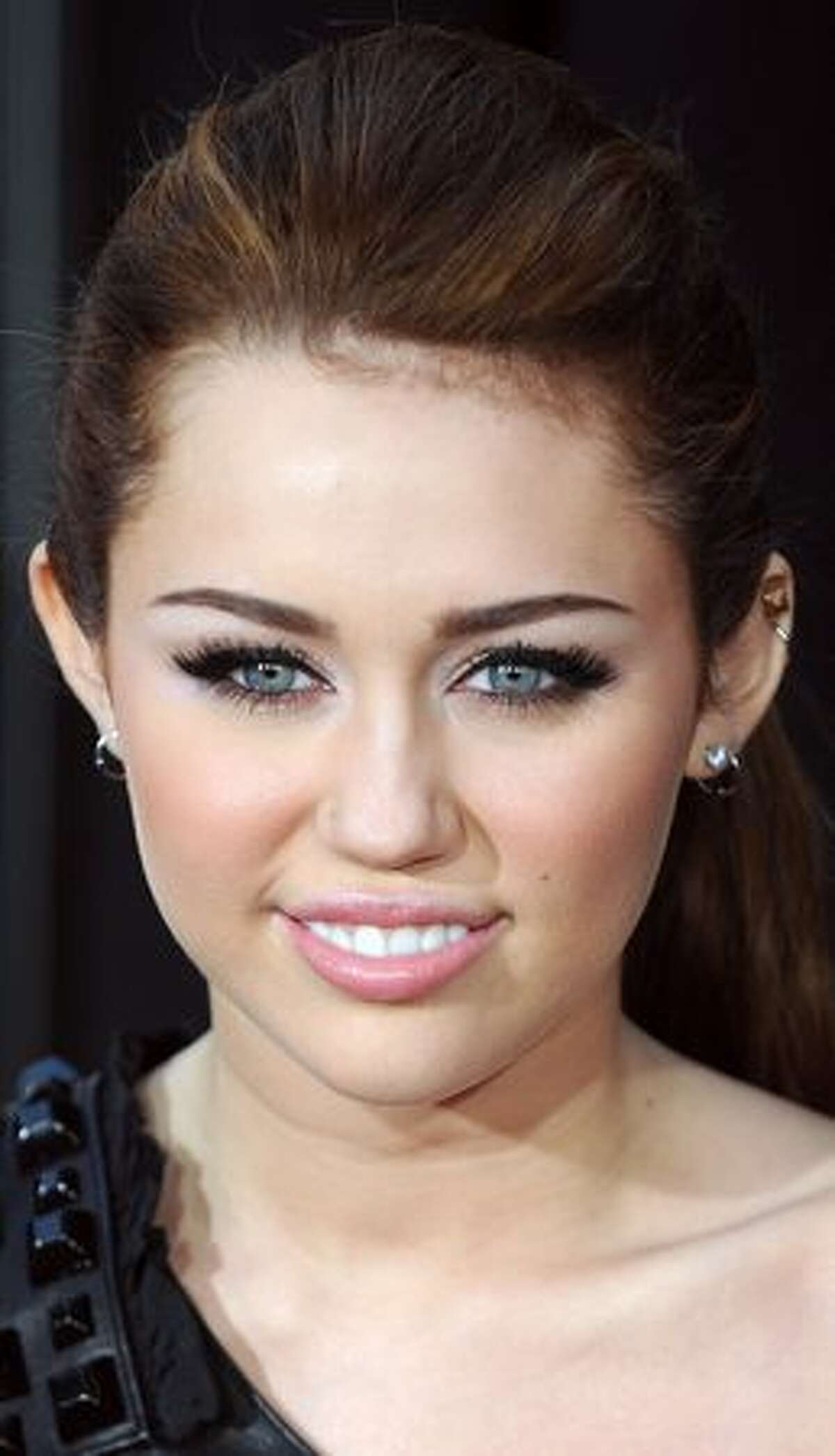 Actress and singer Miley Cyrus arrives for the premiere of "The Last Song" in Hollywood, California.