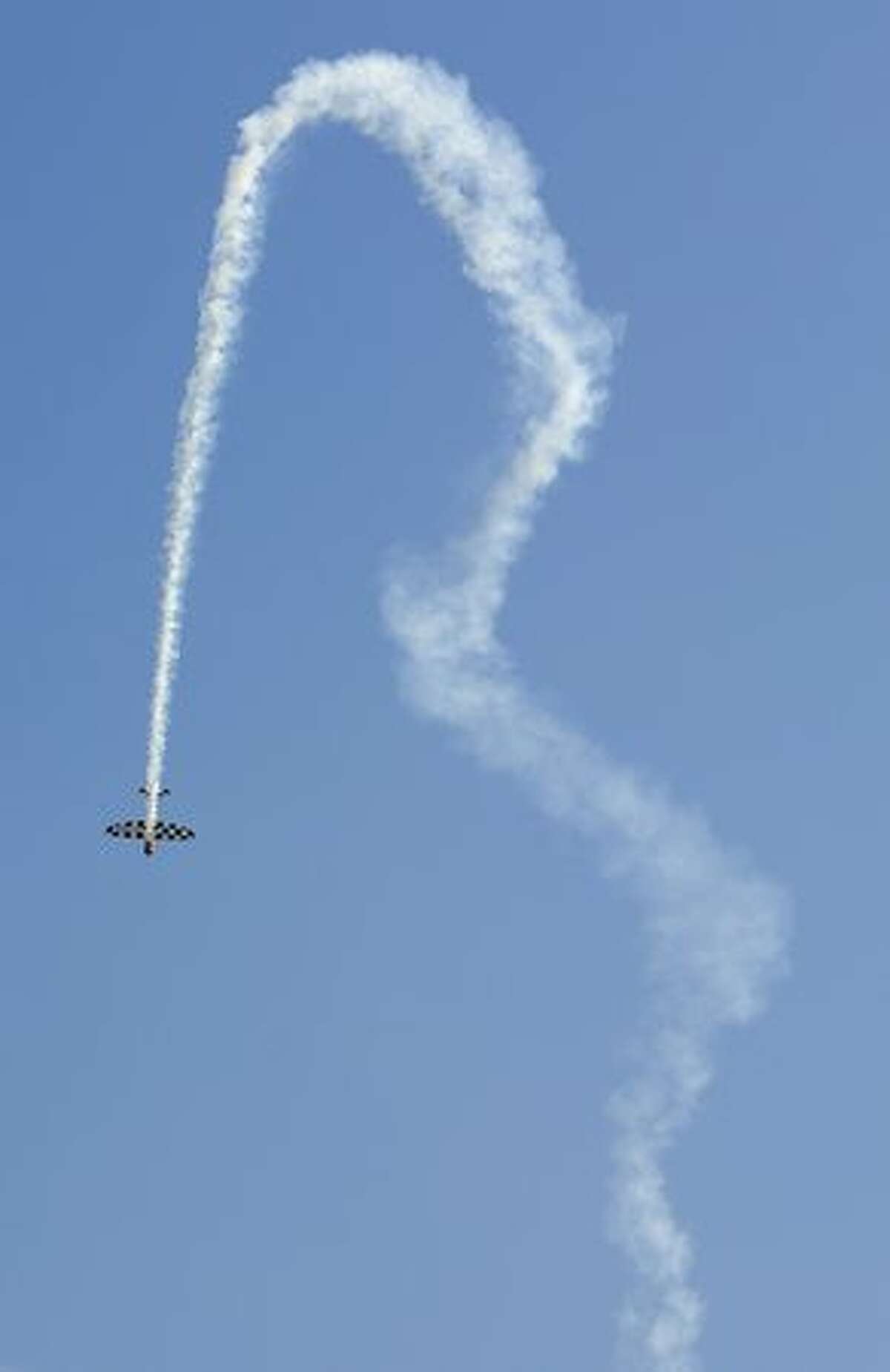 A plane performs aerobatics during the "The Party of Heaven" air show 2010" in Barcelona.
