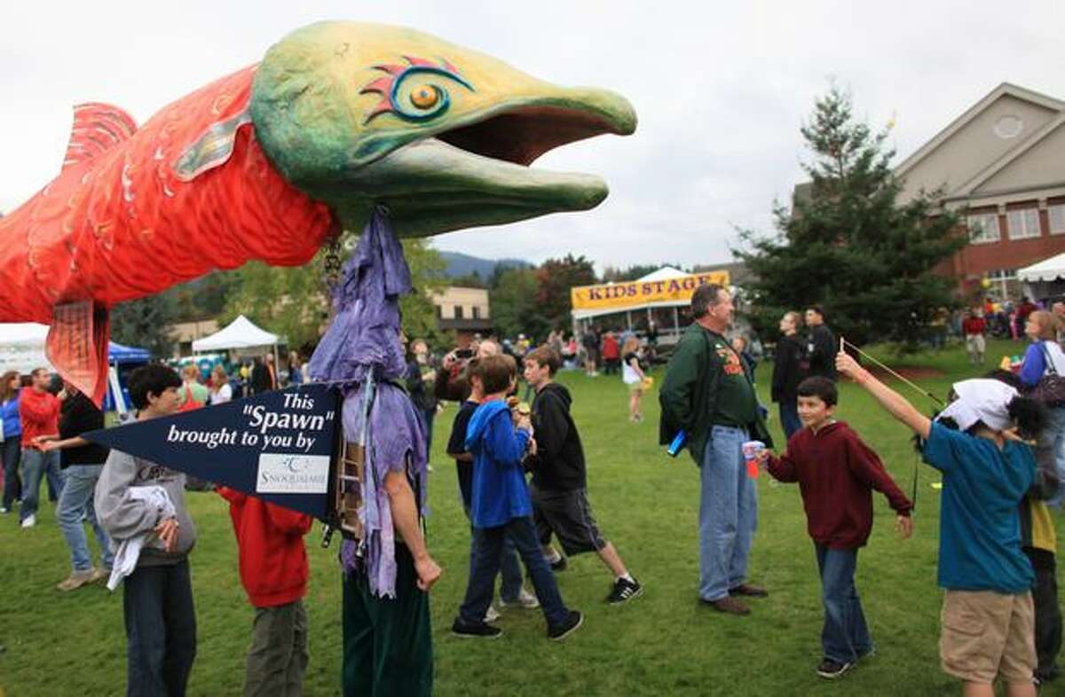 A "salmon" meanders through the crowd during the Issaquah Salmon Days festival on Sunday, October 3, 2010.
