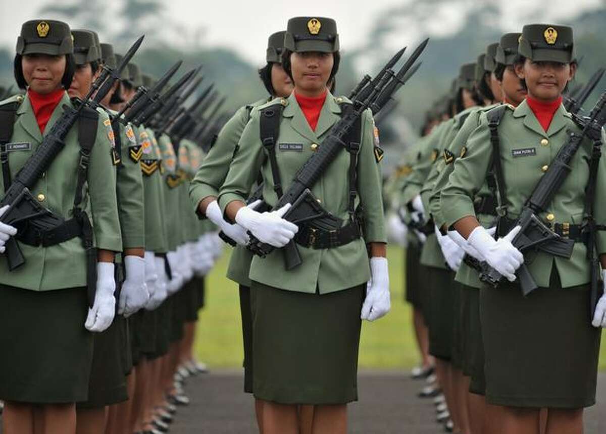 Indonesian army troops line up during a rehearsal of the 65th anniversary ceremony in Jakarta.