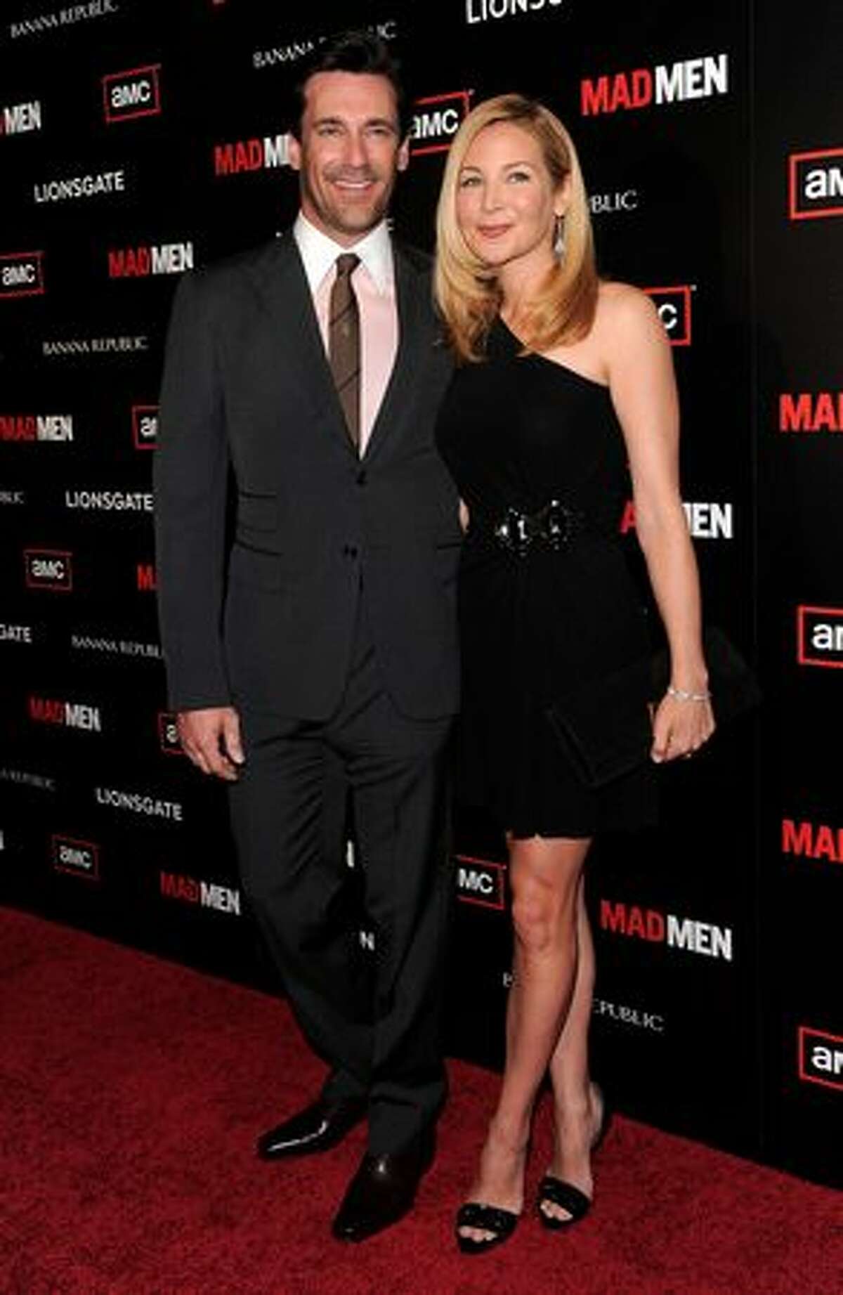 Actor Jon Hamm, who stars as Don Draper in "Mad Men", poses with his longtime girlfriend, actress Jennifer Westfeldt, at the show's season 4 premiere in Hollywood, California.