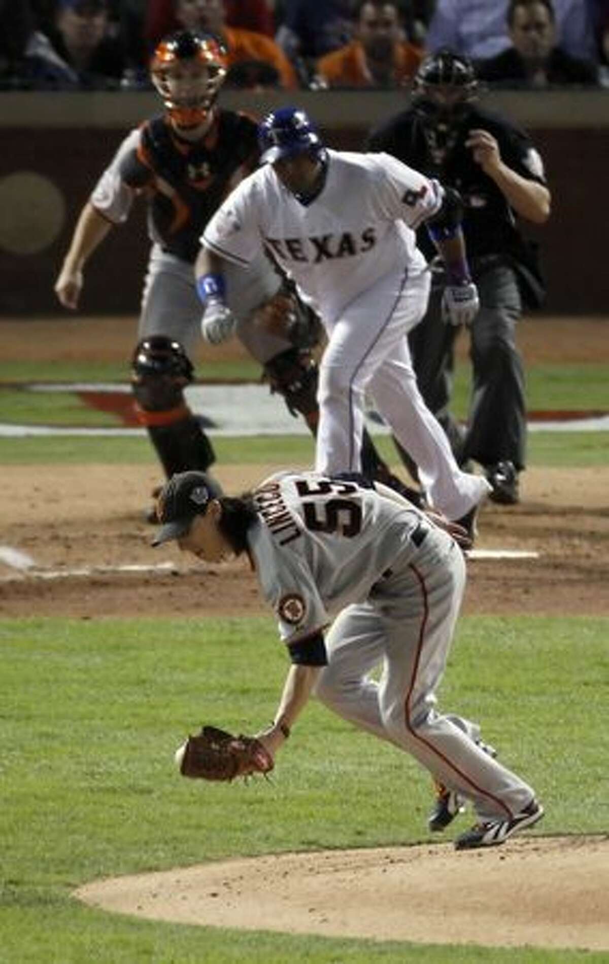 San Francisco Giants starting pitcher Tim Lincecum (55) fields a Bengie Molina hit to end the fifth inning during game 5 of the 2010 World Series between the San Francisco Giants and the Texas Rangers on Monday in Arlington, Tx.