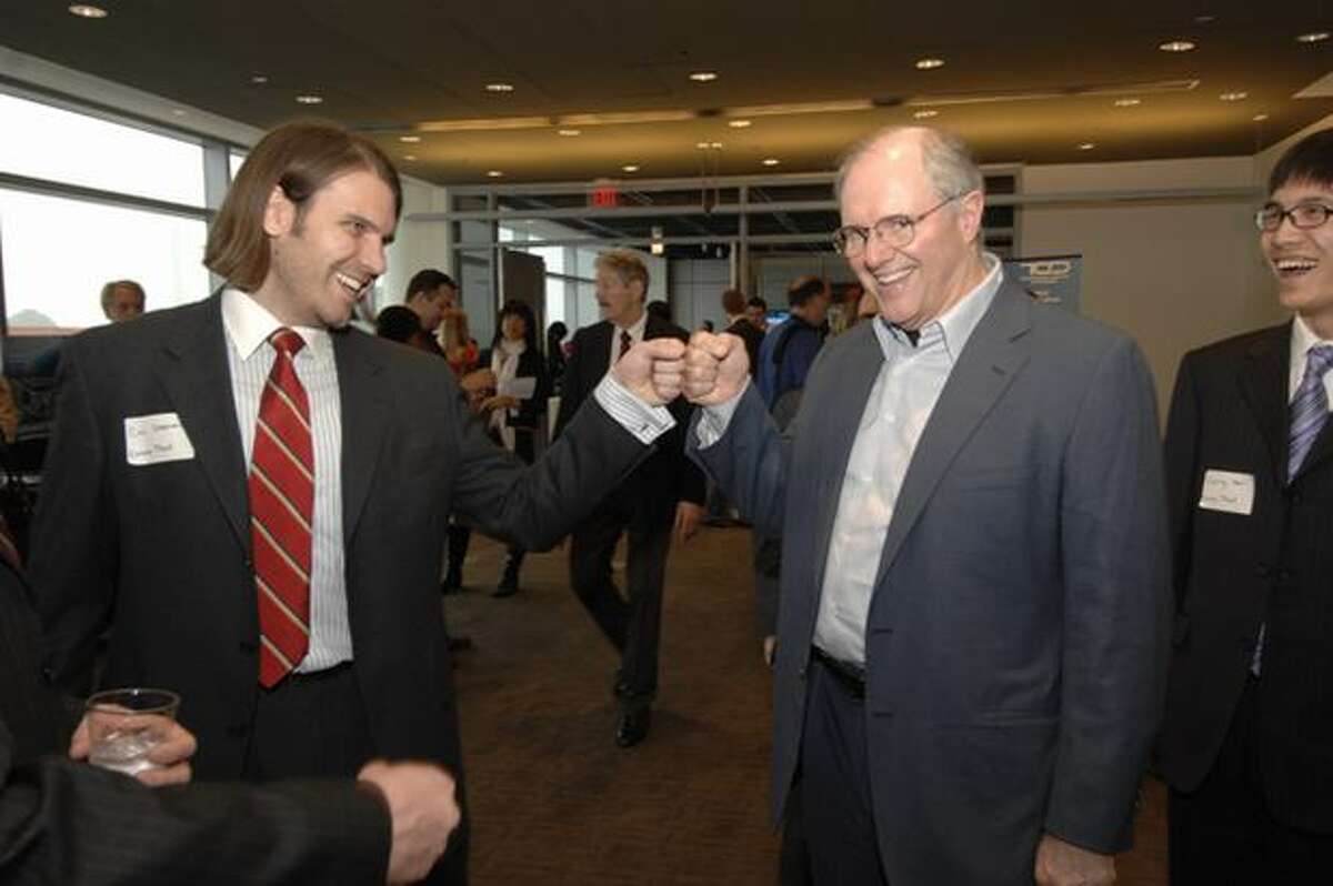 Microsoft’s Craig Mundie bumps fist with U.S. Imagine Cup competitor Cal Coopmans of Utah State University at the Newseum in Washington, D.C. (Microsoft photo)