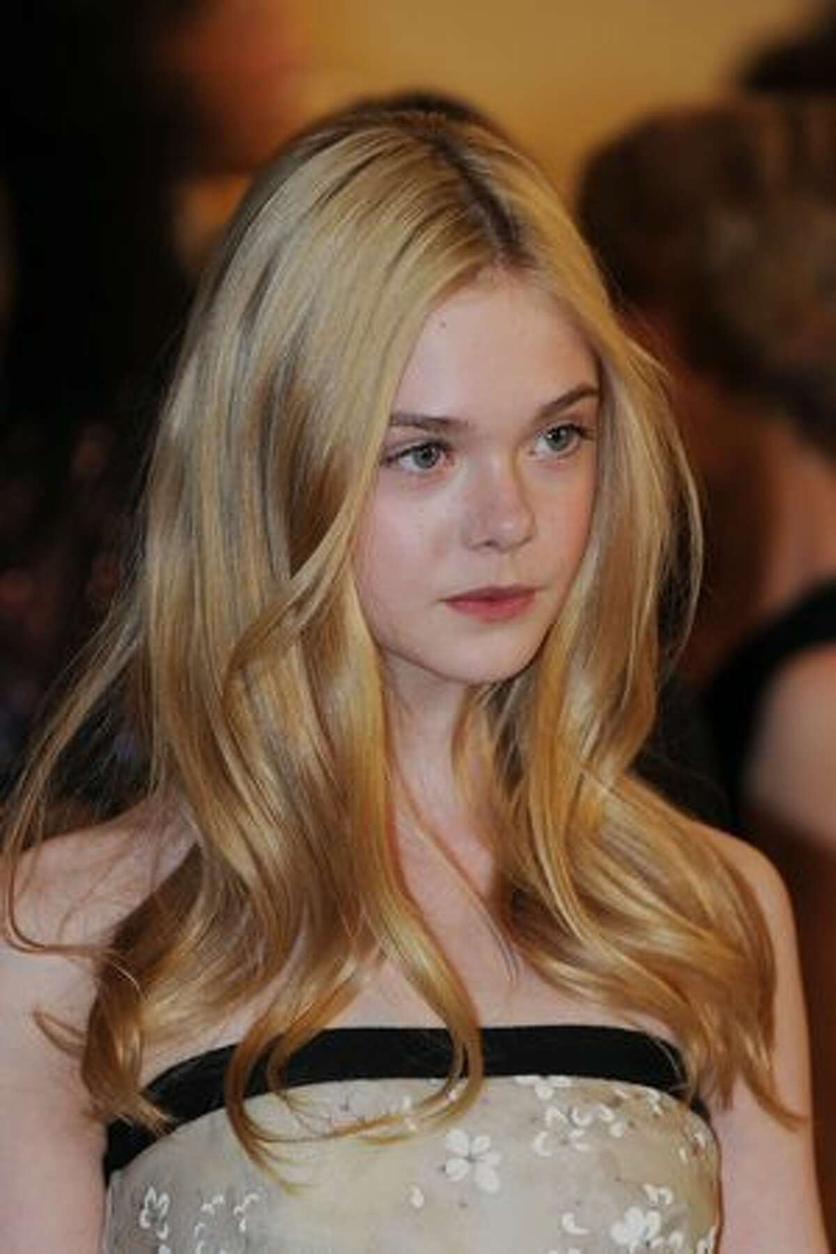 Actress Elle Fanning arrives on the red carpet for the 2010 Oscars Governors Ball.