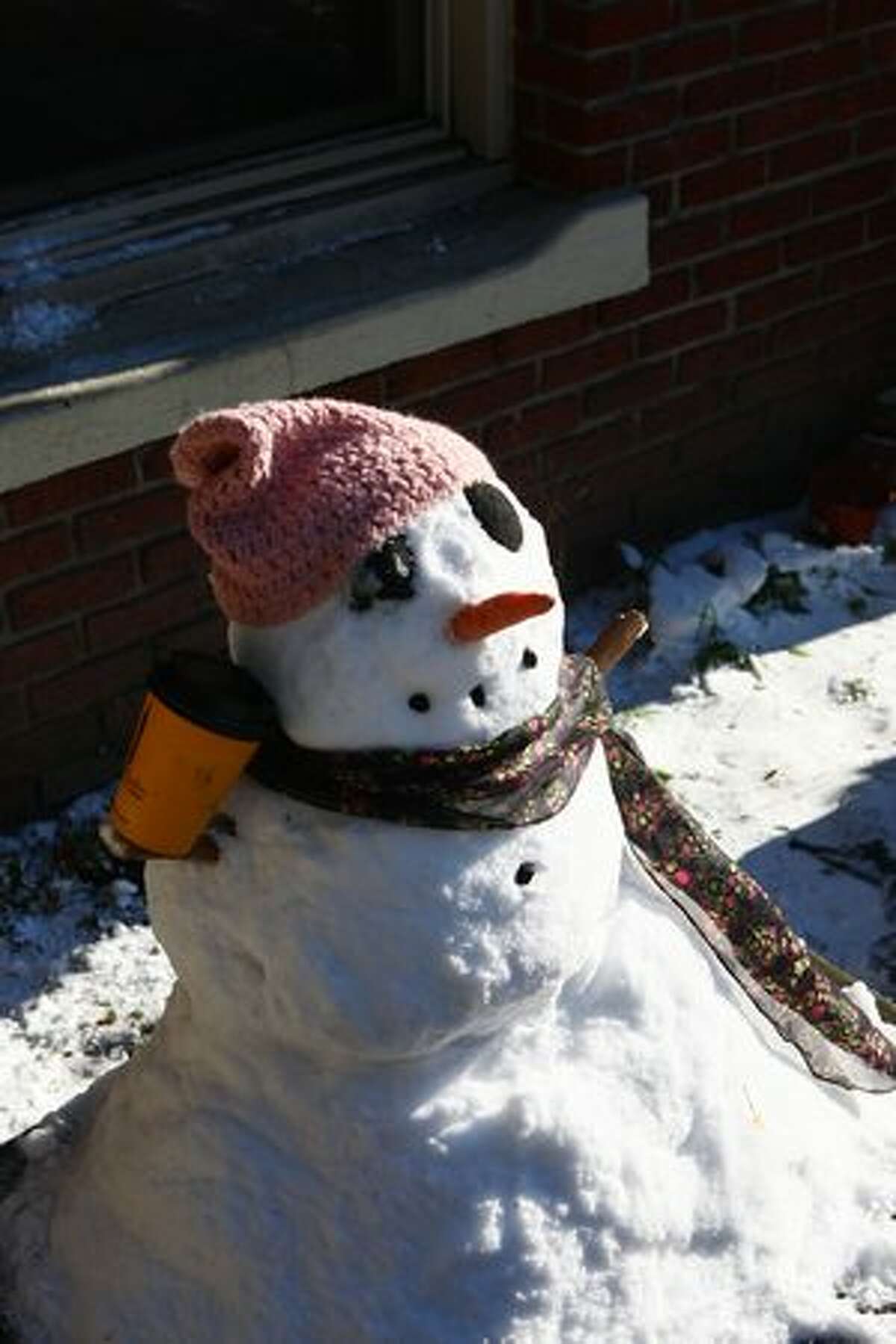 Caffeinated snowman does not care for the sunshine.
