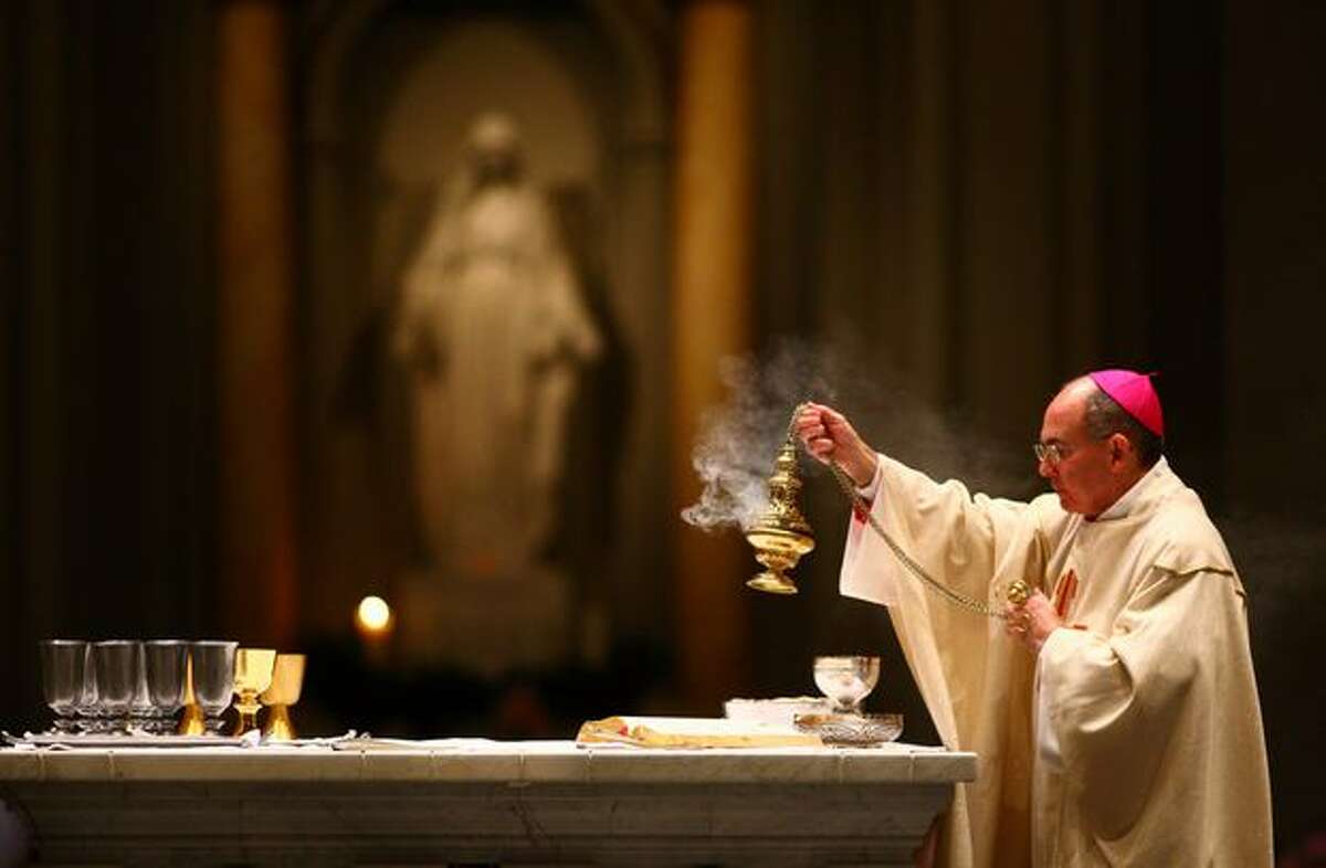 The Most Rev. J. Peter Sartain performs Mass during an installation ceremony at Saint James Cathedral.