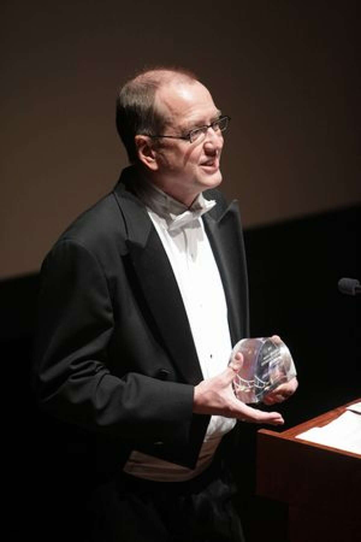 Musician David Sabee of Seattle, who's had a hand in the musical scores of dozens of films, accepts the Mayor's Award.