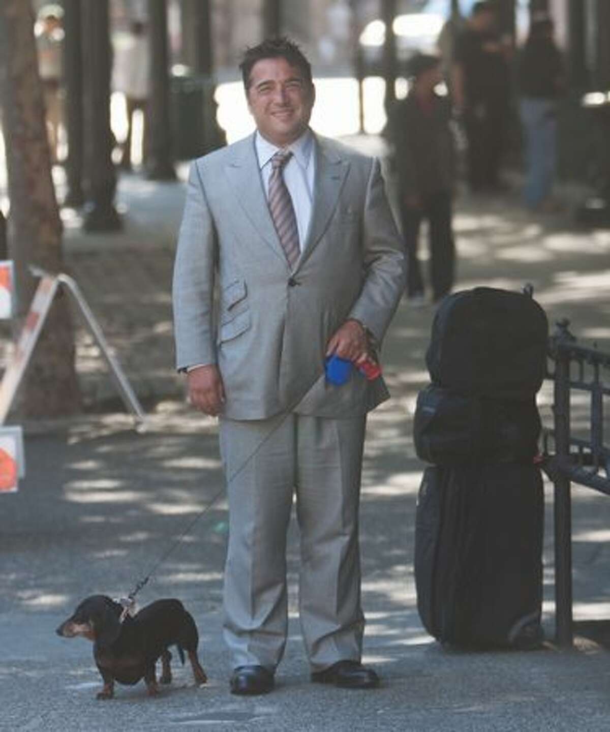 Matthew Bergman confidently strode through Pioneer Square, casually sporting his usual work suit accompanied by his dachshund.
