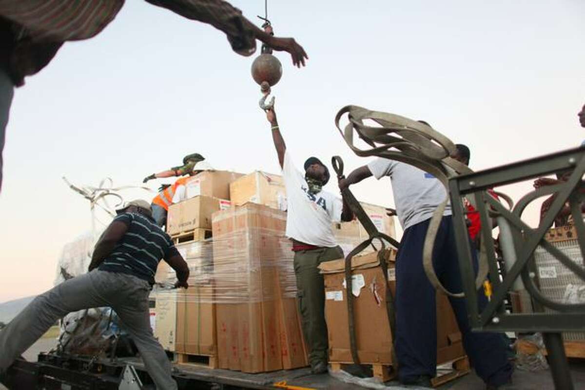 Workers unload equipment at Port-Au-Prince's International Toussaint Louverture Airport. A massive international response was organized after the devastating 7.0 earthquake that destroyed much of the capital city.