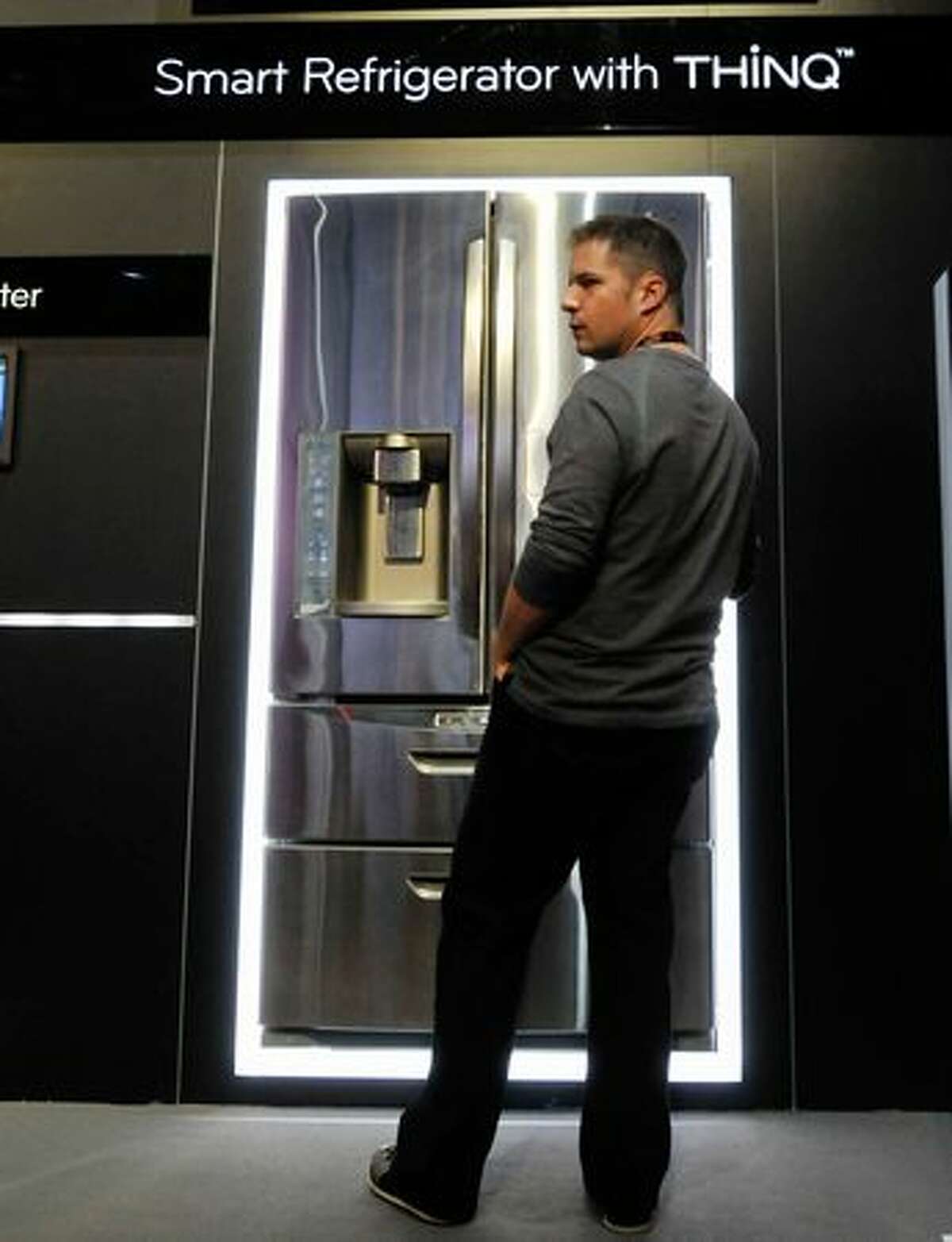 An attendee examines the LG Smart Refrigerator on Jan. 6 at the 2011 International Consumer Electronics Show in Las Vegas.