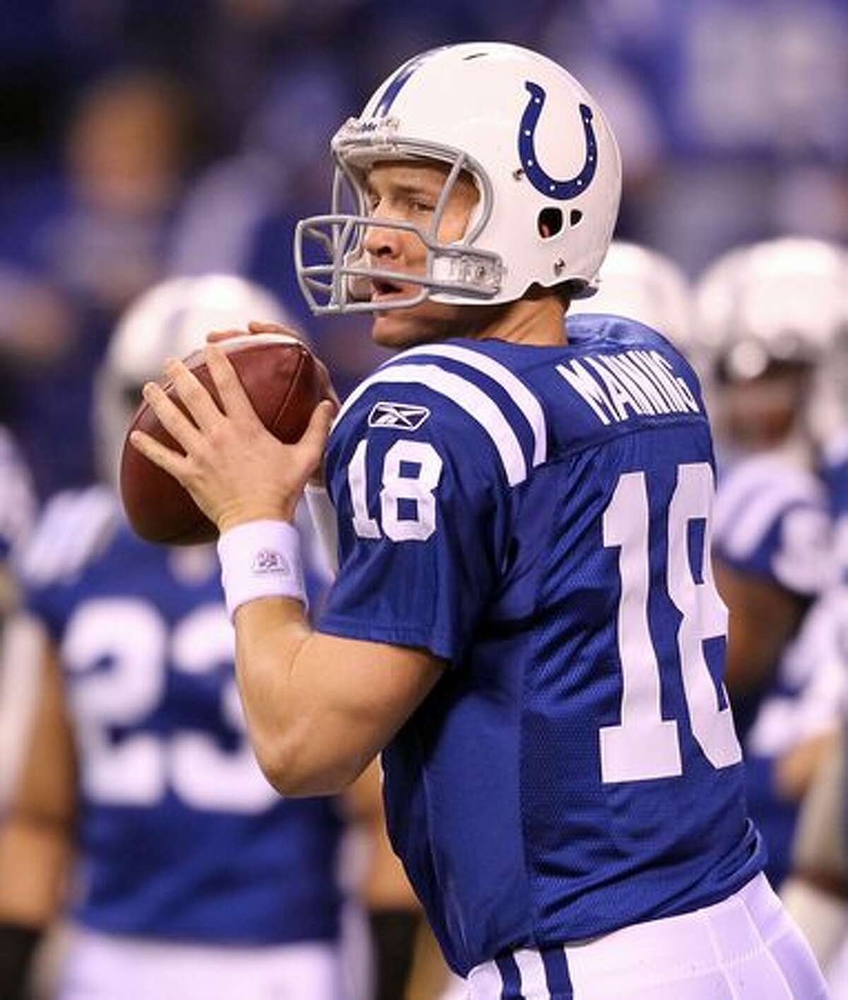 No. 4: Indianapolis Colts quarterback Peyton Manning, shown here throwing a pass on Nov. 28, 2010, before a game against the San Diego Chargers at Lucas Oil Stadium, in Indianapolis, Indiana.