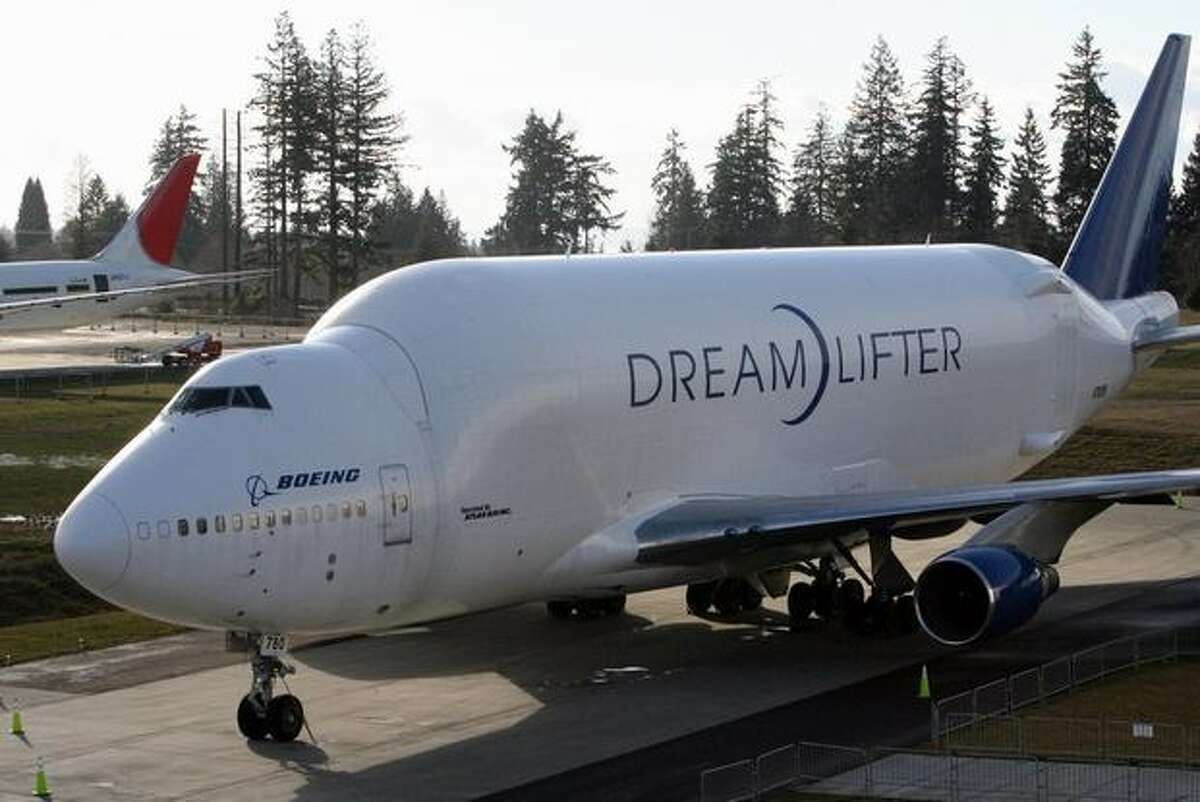 A Boeing Dreamlifter sits beside the Future of Flight Aviation Center at Paine Field, in Everett, Wash.