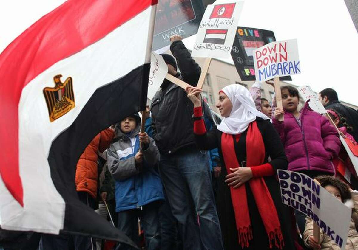 Protesters gather during a protest against Egyptian President Hosni Mubarak and his government on Saturday, Jan. 29, 2011 at Westlake Park in Seattle. Nearly 500 people gathered to show solidarity with protesters that have taken to the streets of Egypt.