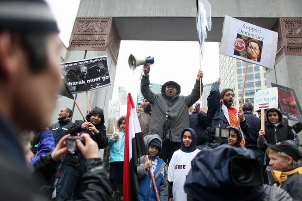 Protesters gather during a protest against Egyptian President Hosni Mubarak and his government at Westlake Park in Seattle. Nearly 500 people gathered to show solidarity with protestors that have taken to the streets of Egypt.
