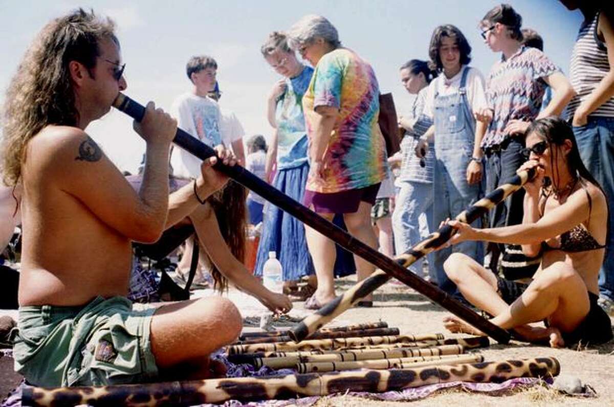 Mark Renner, left, and Patrice Sunshine, right, play the Didjeridu, an instrument native to Australia, at the 4th Annual Seattle Hempfest at Gasworks Park in 1994. (Photo by Jim Davidson)