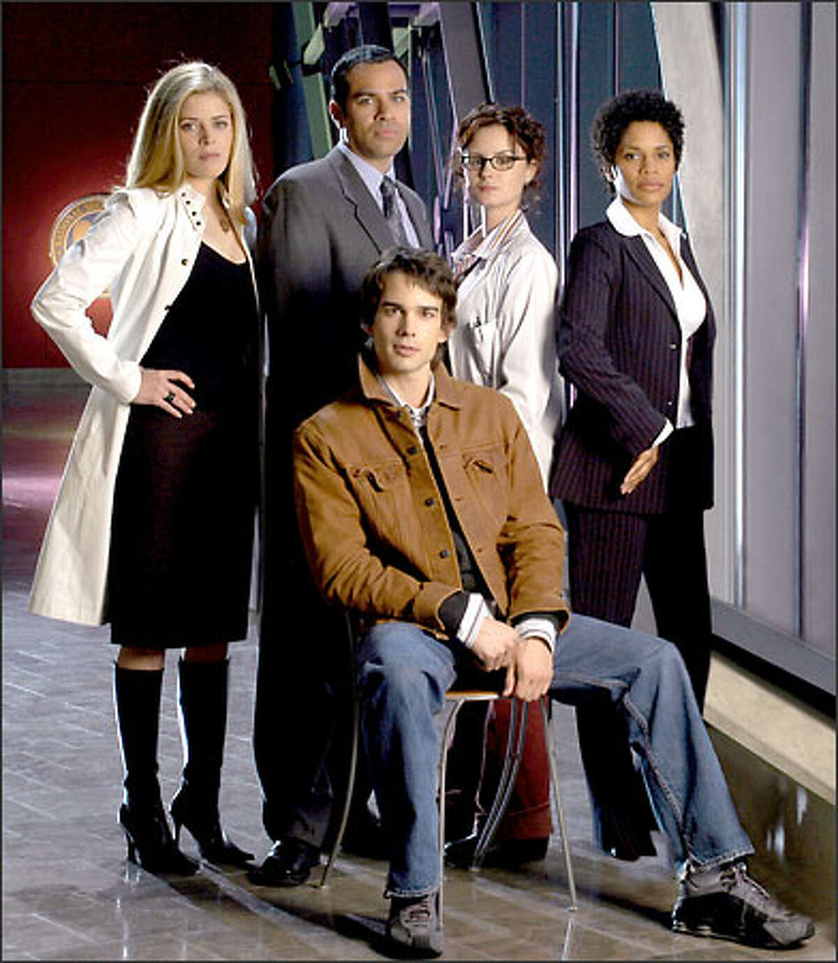 From left, standing, Marina Black, Phillip Anthony-Rodriguez, Keegan Connor Tracy and Judith Scott, and seated, Christopher Gorham comprise the primary cast of "Jake 2.0" on UPN.