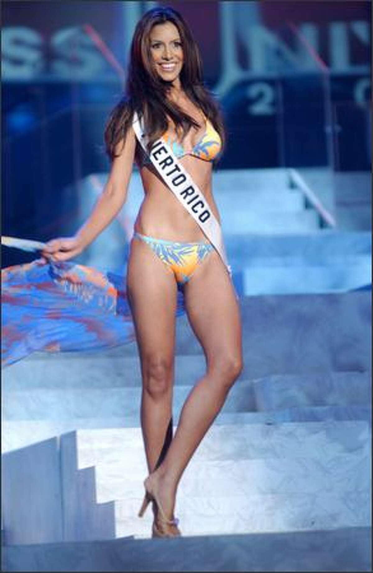 Alba Giselle Reyes Santos, Miss Puerto Rico, competes in her Endless Sun swimsuit during the 2004 Miss Universe Presentation Show on May 27 at CEMEXPO in Quito, Ecuador. Each delegate is judged by a preliminary panel of distinguished judges in three categories consisting of individual interview, swimsuit competition and evening gown competition. The scores will be tallied and the top 15 delegates will be announced during the NBC broadcast of the 53rd annual Miss Universe competition on June 1 at 9 p.m. (delayed PT).