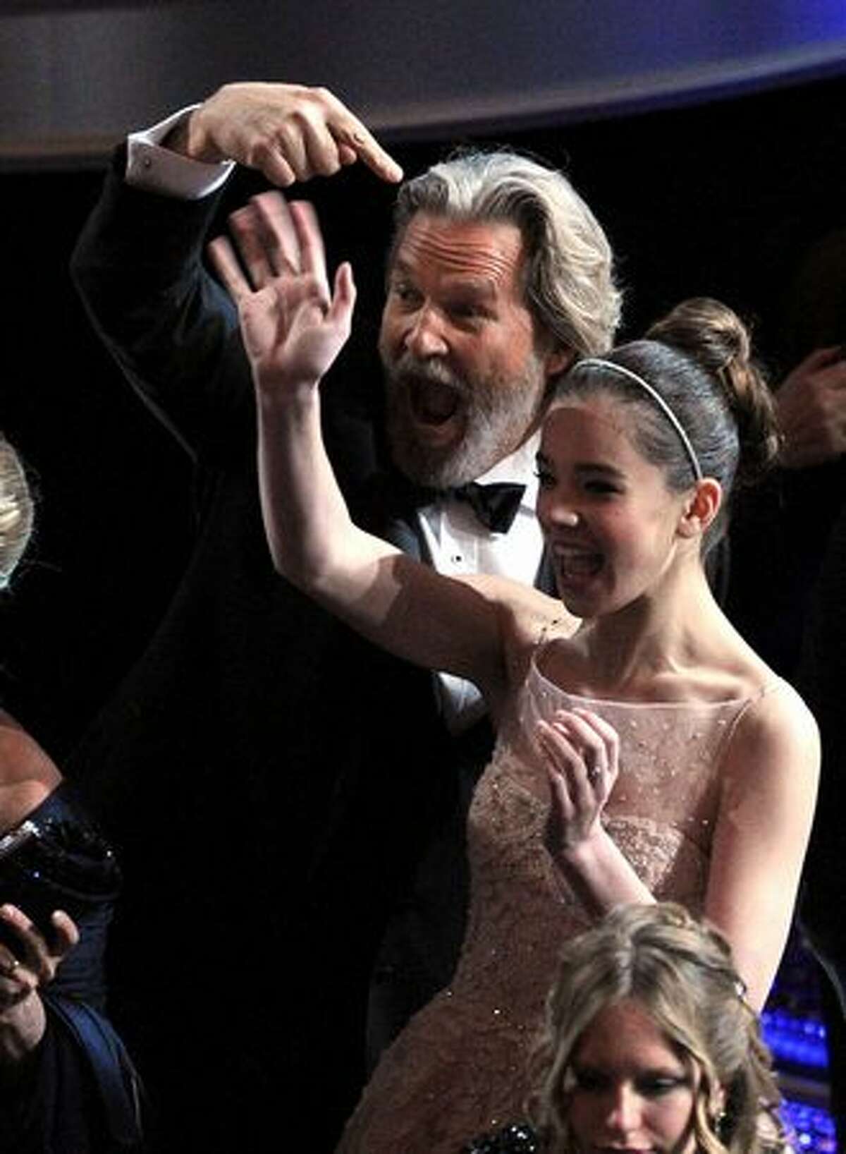 Actor Jeff Bridges and actress Hailee Steinfeld smile in the audience before the 83rd Annual Academy Awards held at the Kodak Theatre in Hollywood, California.