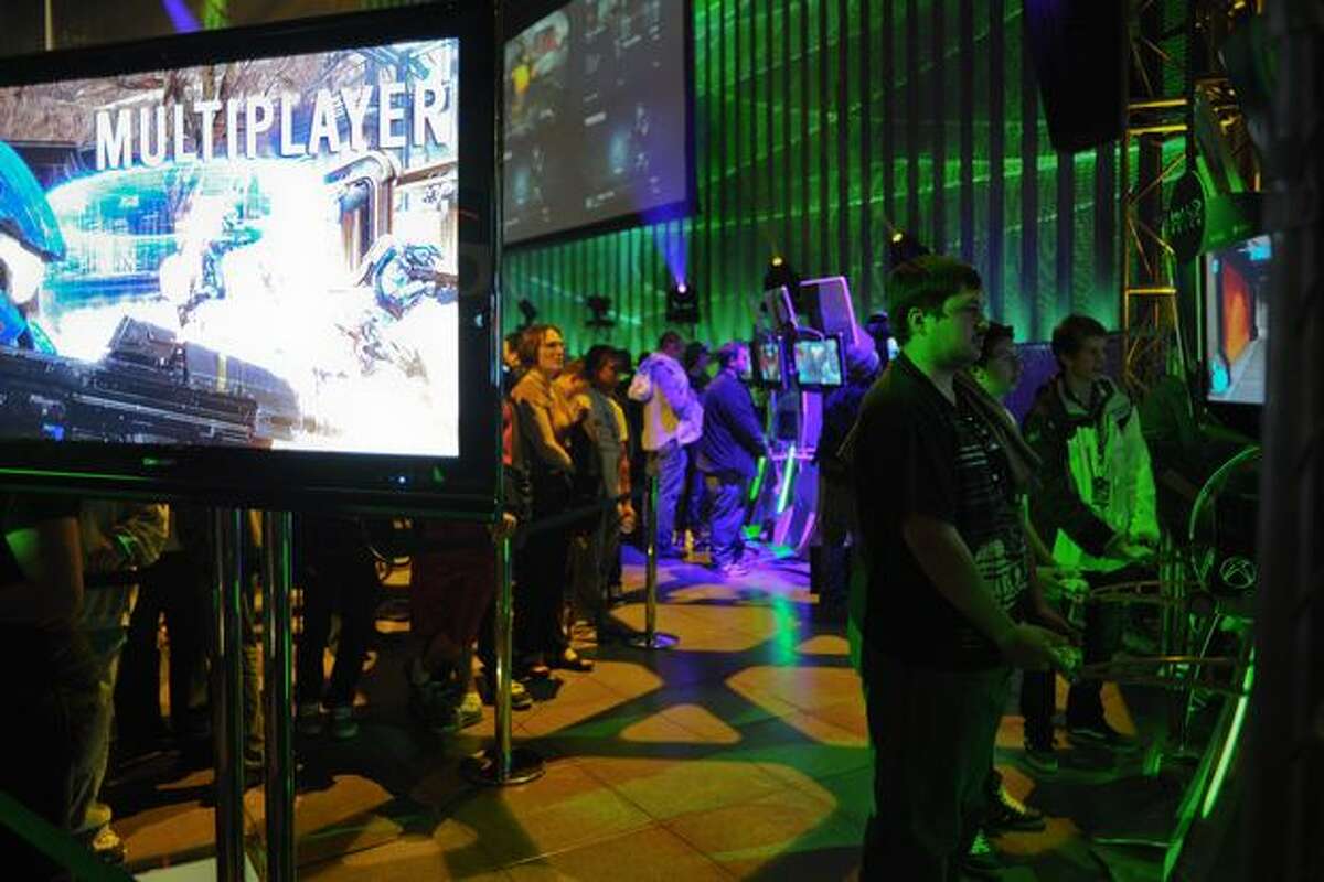 Attendees wait in long lines to play "Halo: Reach" at its release party at the Experience Music Project in Seattle Center on Monday, Sept. 13, 2010.