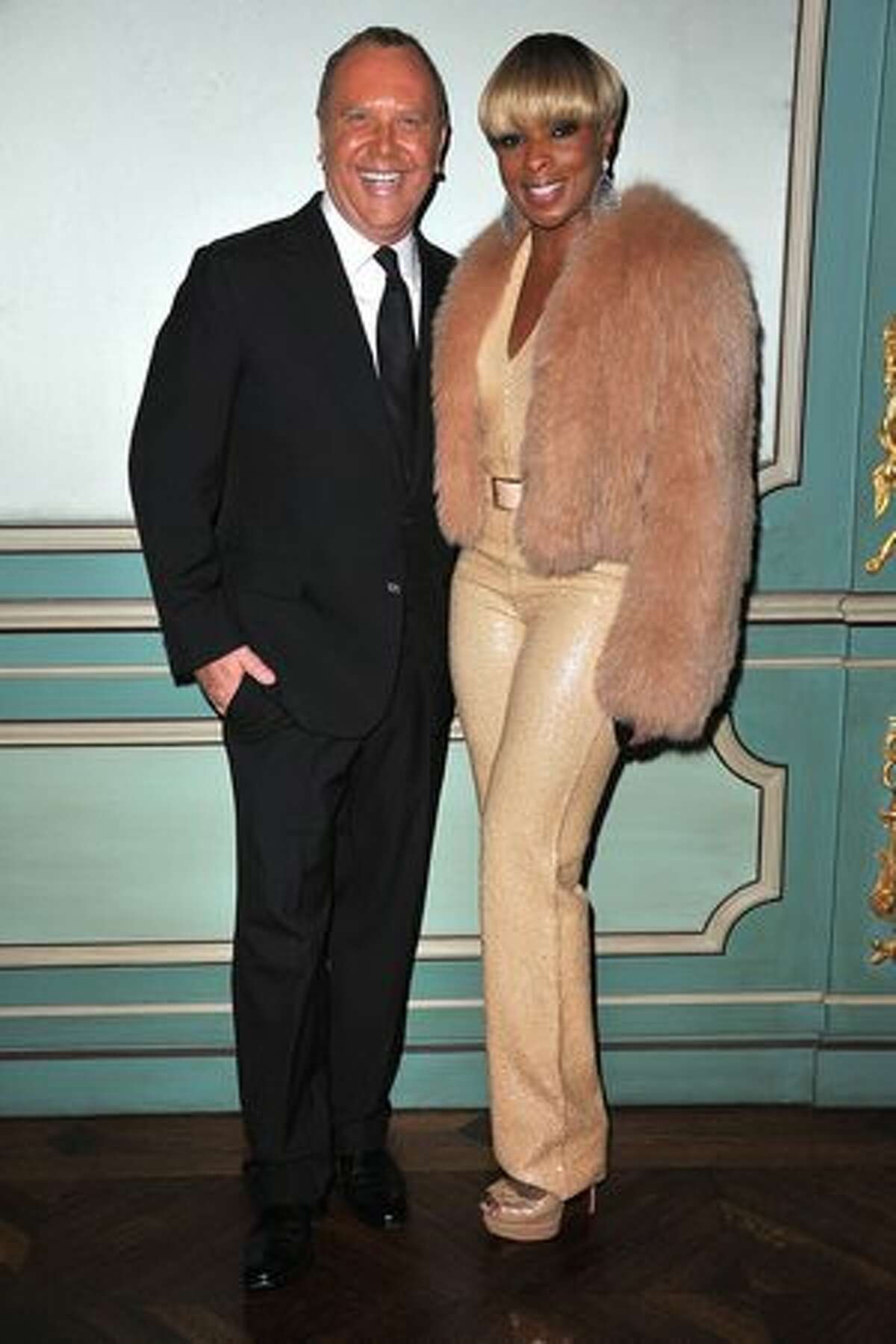 Michael Kors and Mary J. Blige attend a cocktail and dinner hosted in honor of designer Michael Kors during Paris Fashion Week Fall/Winter 2012 at the Embassy Of The United States in Paris, France.