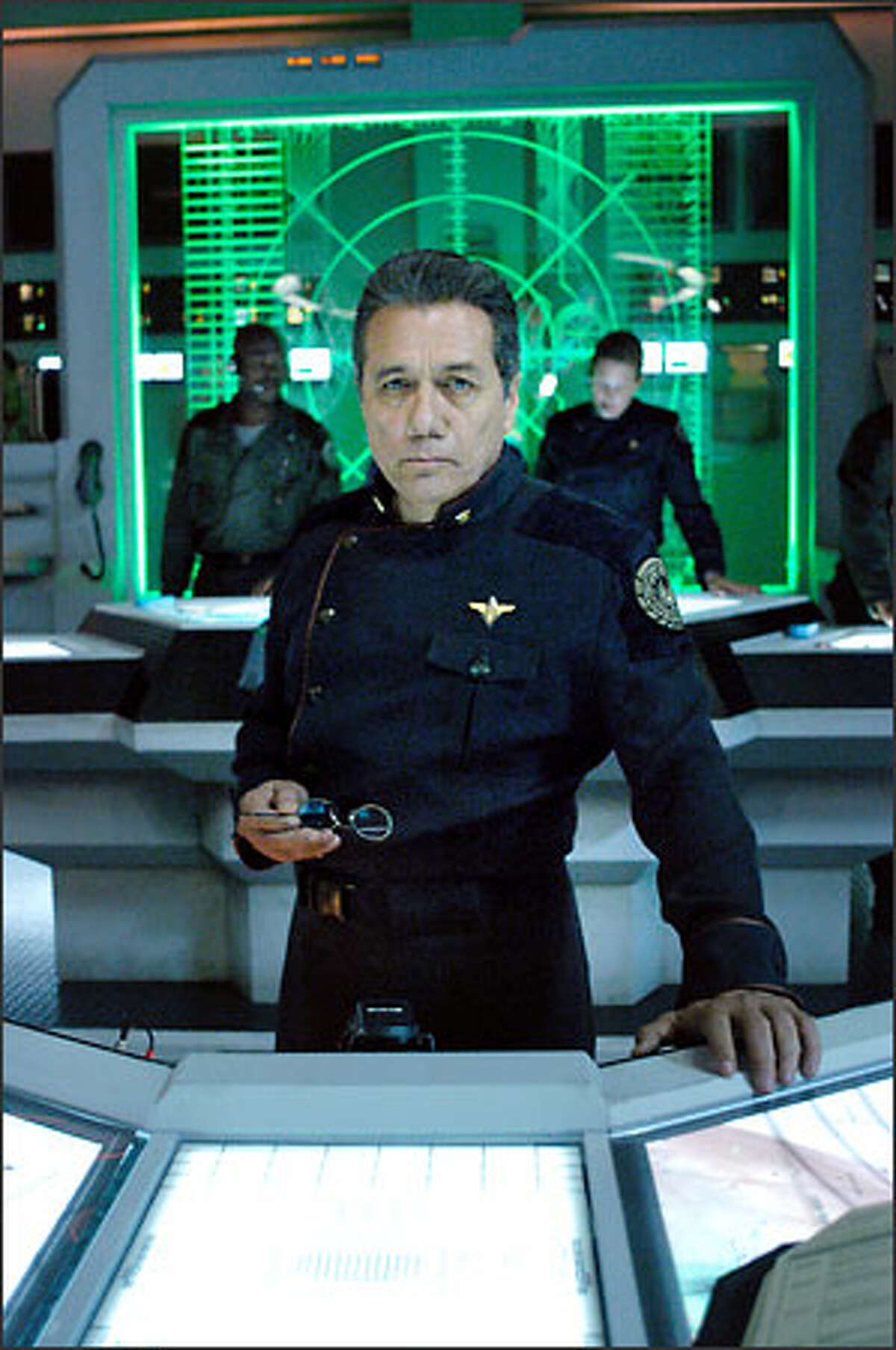 William Adama (Edward James Olmos), commander of Galactica, the last Colonial battlestar, leads the survivors of the Cylon attack on a quest for the legendary lost human colony called Earth. "Battlestar Galactica" airs on the Sci-Fi Channel Dec. 8-9, 2003.