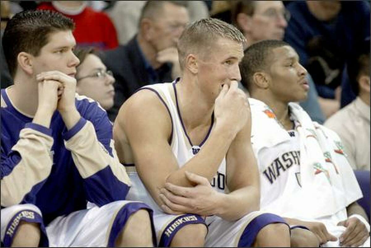 Husky Mike Jensen, center, looks worried as Gonzaga pulls ahead of Washington at the end of the first half.