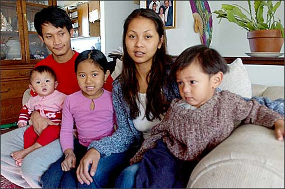 Southwest Youth and Family Services has assisted Chomrong Sok and her three children, 7-month old Tetiana Mountha, 6-year-old Mylin Srouch and 2-year-old Atreu Mountha. Trez Mountha holds his daughter Tetiana and also is the father of Atreu. Southwest Youth and Family Services is a beneficiary of the P-I Readers Care Fund.