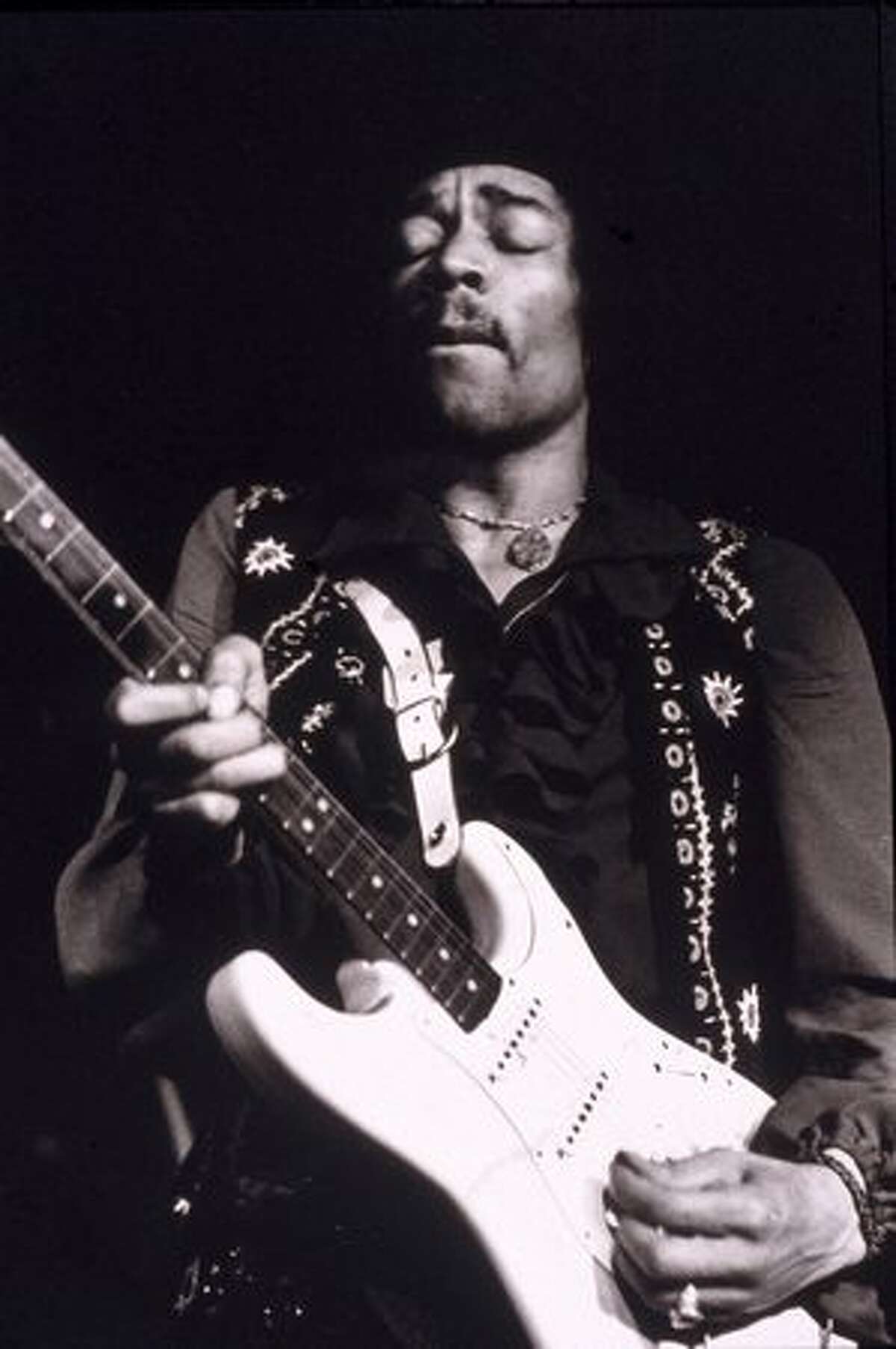 American musician Jimi Hendrix (1942 - 1970) performs onstage, late 1960s.