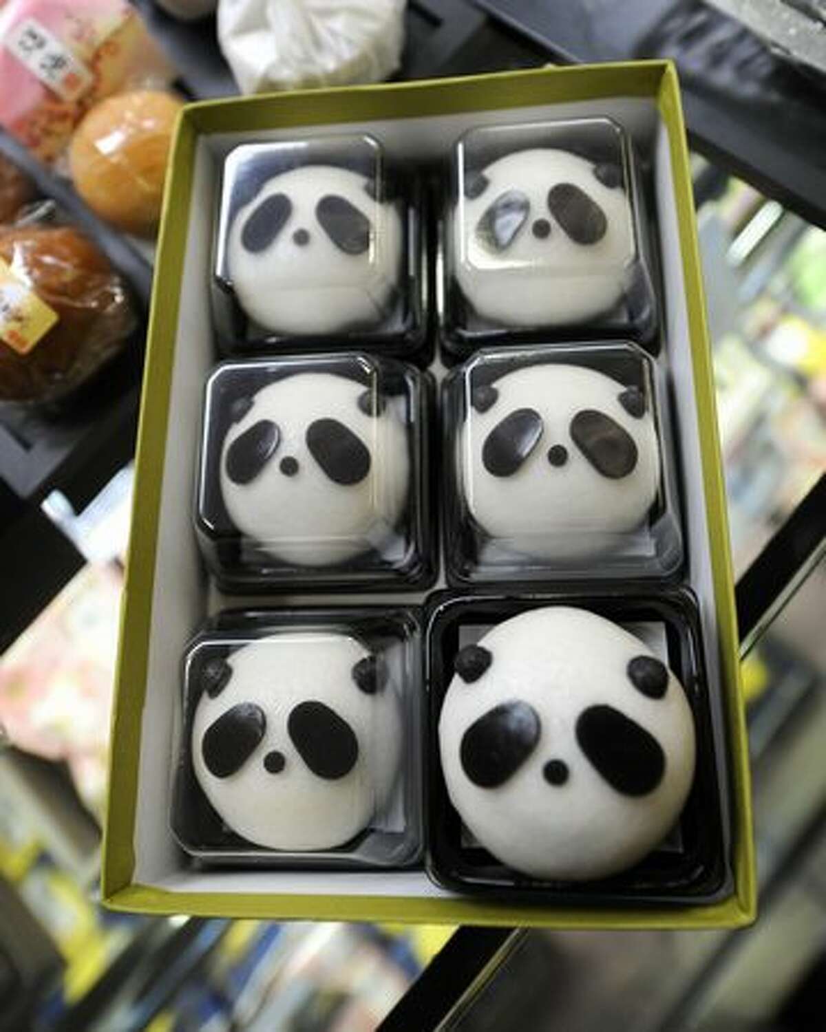 Panda-shaped manju, buns stuffed with adzuki-bean paste, are displayed in Tokyo on February 21, 2011. Panda fever gripped Japan as a pair of the bamboo eaters was heading in from China, with Tokyo's zoo eying a visitor boom and the government predicting smoother ties with Beijing.