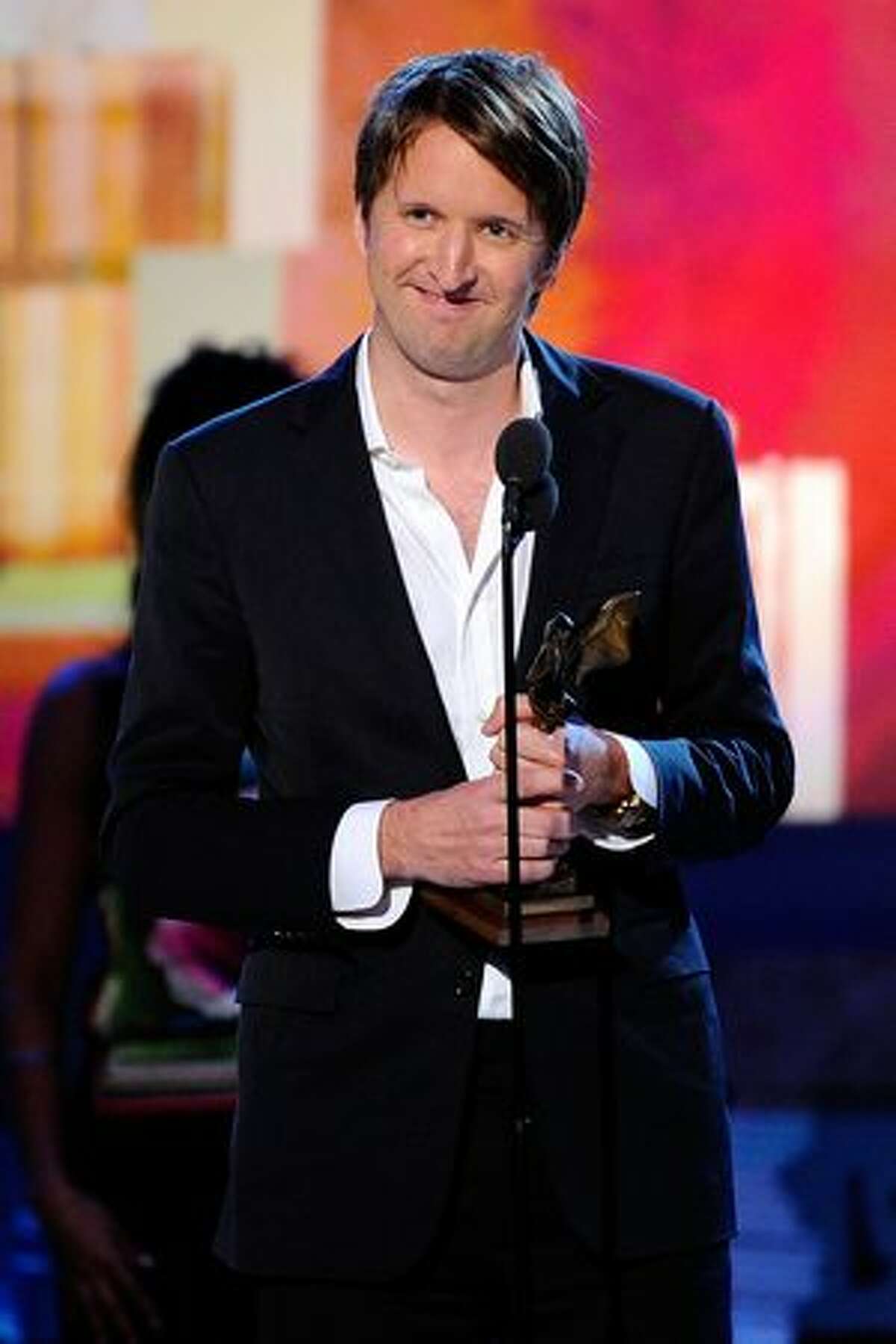 Director Tom Hooper, winner of Best Foreign Film award for 'The King's Speech,' accepts award onstage.
