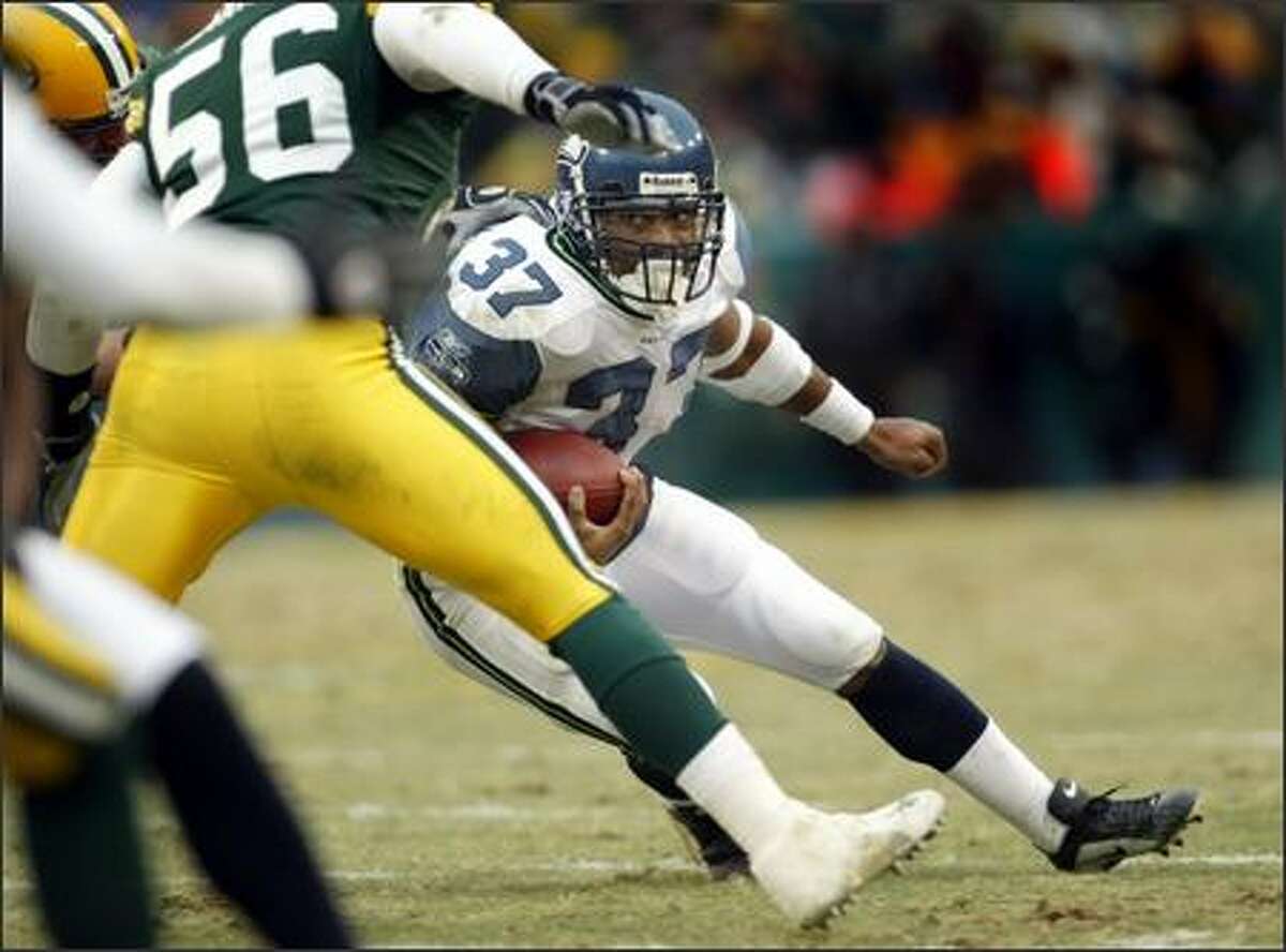 Seahawks running back Shaun Alexander (37) did score three touchdowns but found running room scarce as he rushed for only 45 yards on 20 carries.