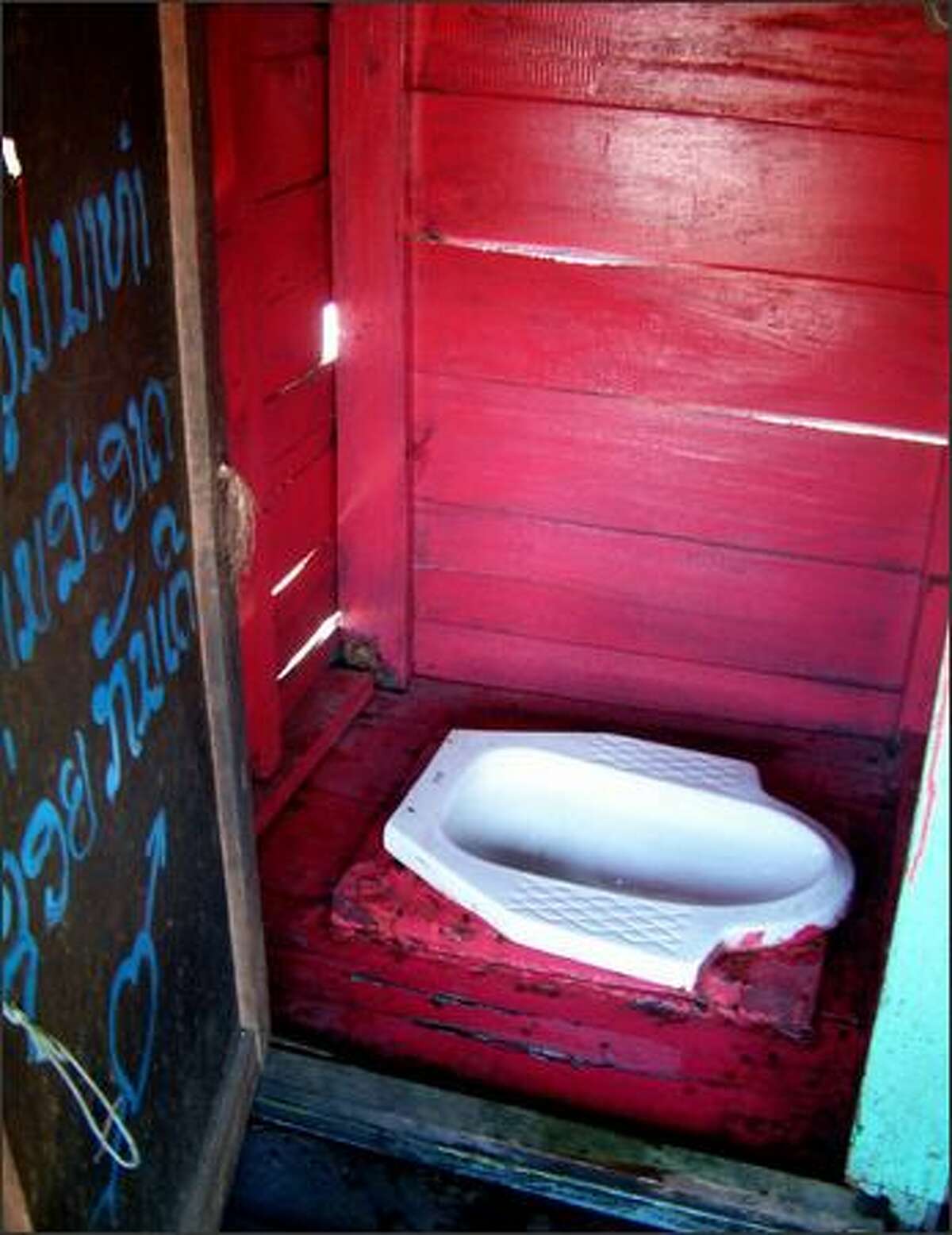 A two-day boat trip down the Mekong River in Laos introduced me to the smallest restroom in the world. A four-foot-tall wooden box on the back of the barge enclosed a bare squat-style toilet.