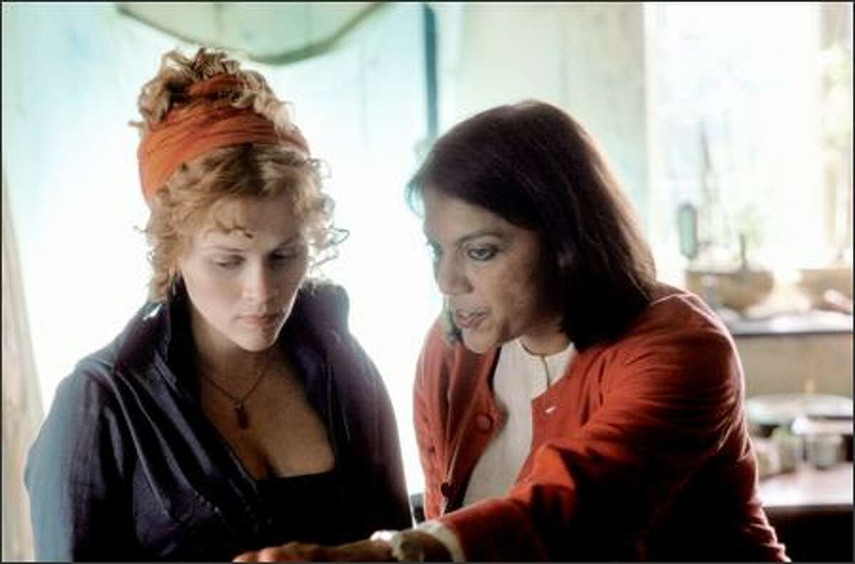 Reese Witherspoon and Mira Nair on the set of "Vanity Fair," a Focus Features release. The film is rated PG-13 for some sensuality (partial nudity) and for a brief, violent image. The film runs two hours and 21 minutes. Nair, a native of India, has directed "Salaam Bombay!" "Mississippi Masala" and "Monsoon Wedding."